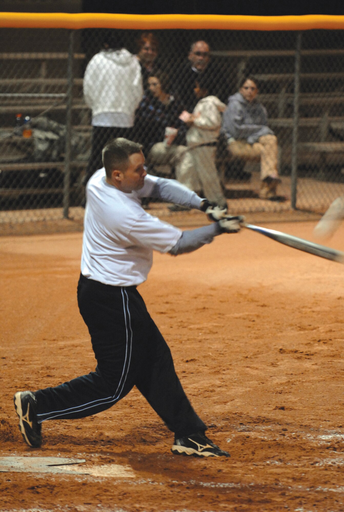 Keith Brown hits a ball to centerfield during an intramural softball game between the 56th Operations Group and the 607th Air Control Squadron. (U.S. photo/ Airman 1st Class C.J. Hatch.)