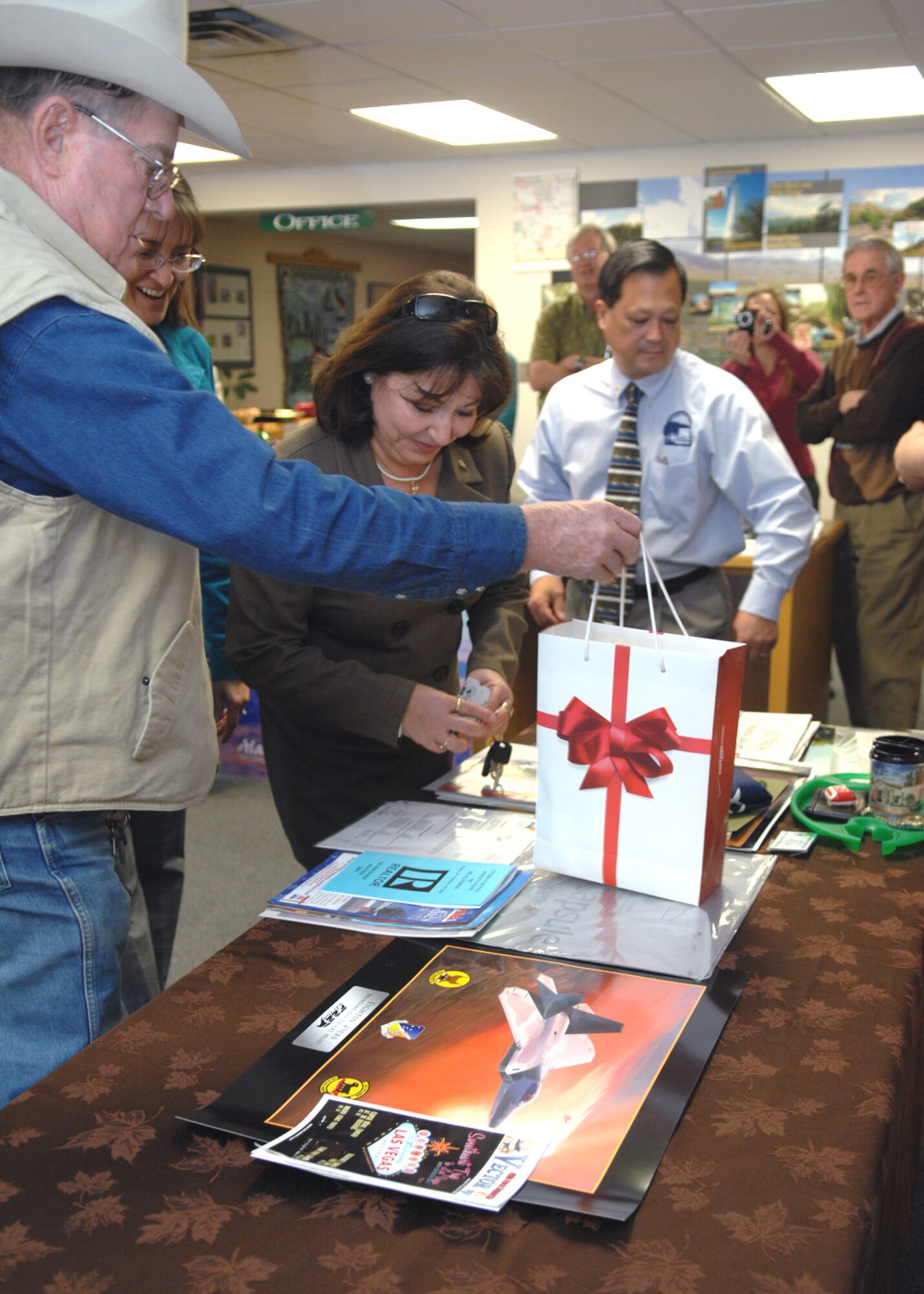 Local organizations gather items to place into the 2008 time capsule at the Alamogordo Chamber of Commerce, N.M., Jan. 21. Every 25 years, the time capsule is scheduled to open for future citizens of Alamogordo to view each period of time. (U.S. Air Force photo/Airman 1st Class Veronica Salgado)