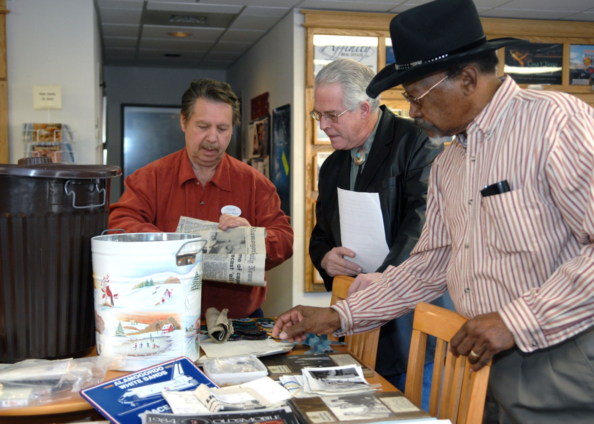 Alamogordo Chamber opens 1983's time capsule for members of the community to view at the Alamogordo Chamber of Commerce, N.M., Jan. 21. Another time capsule was has been buried and scheduled to open in 2033. (U.S. Air Force photo/Airman 1st Class Veronica Salgado)