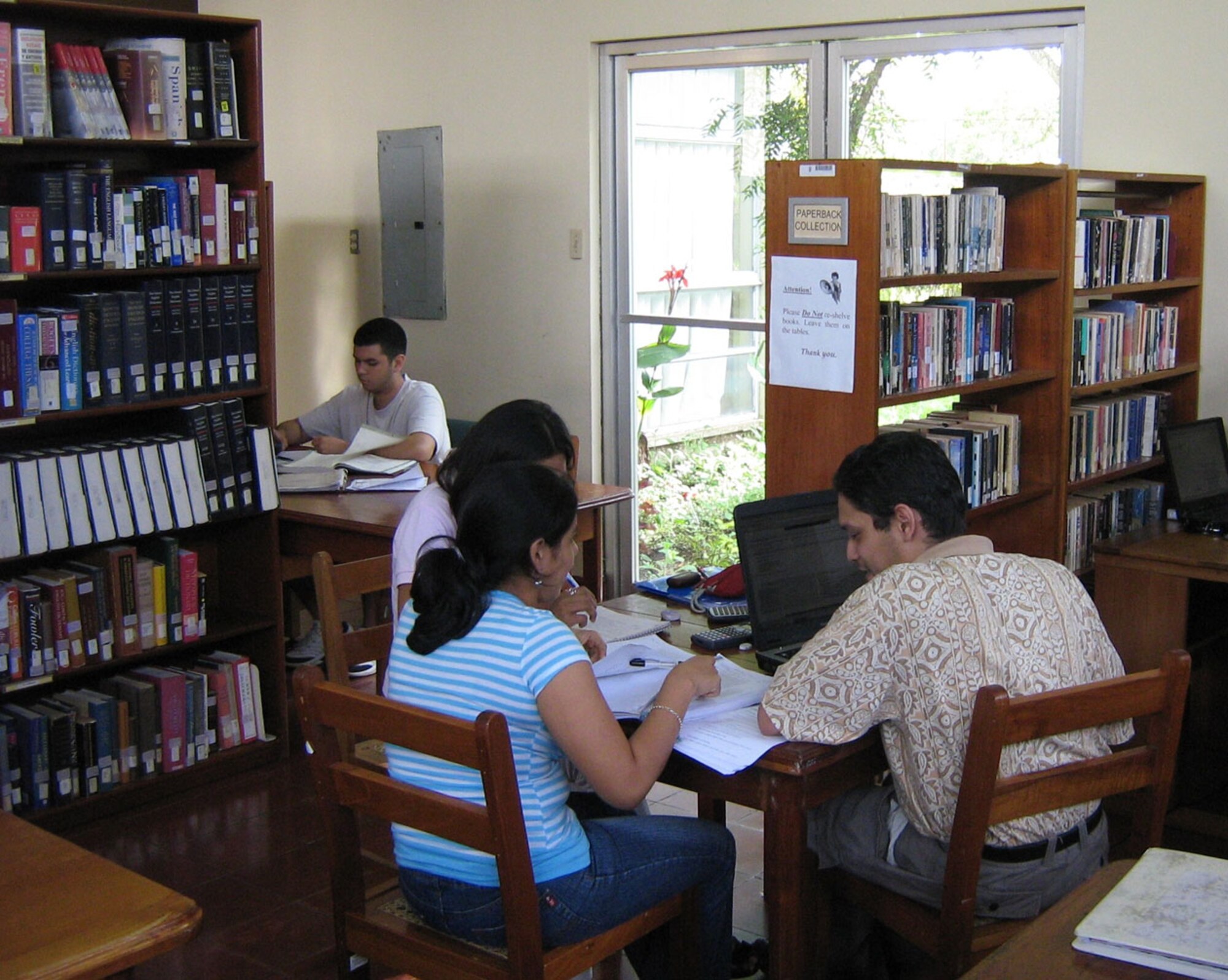 DOVER AIR FORCE BASE, Del. -- Students study in the Ave Maria University, Latin American Campus, in San Marcos, Carazo, Nicarauga. The university is building a new library and the Air Force Reserve's 326th Airlift Squadron delivered 18,000 pounds of humanitarian cargo consisting of desks, chairs, file cabinets and books to the Managua International Airport, Nicarauga, as part of the Denton Program. The Denton Program is a Department of Defense transportation program that uses available military air, surface and sea-lift assets to deliver humanitarian cargo donated by charities or private donors. (Ave Maria University photo)