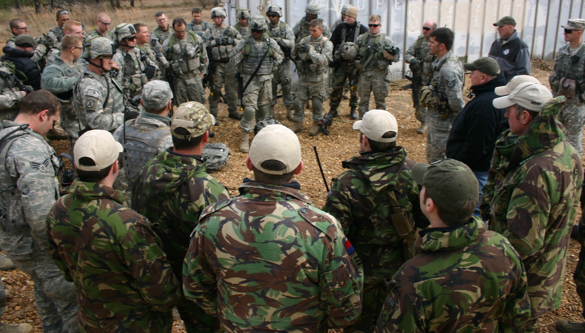 FORT POLK, La. -- U.S. Air Force and British joint terminal attack controllers and U.S. Army joint fires observers conduct an AAR with JRTC, Green Flag East and JFIIT training mentors during JRTC rotation 09-03. (U.S. Air Force photo/Casey E. Bain)