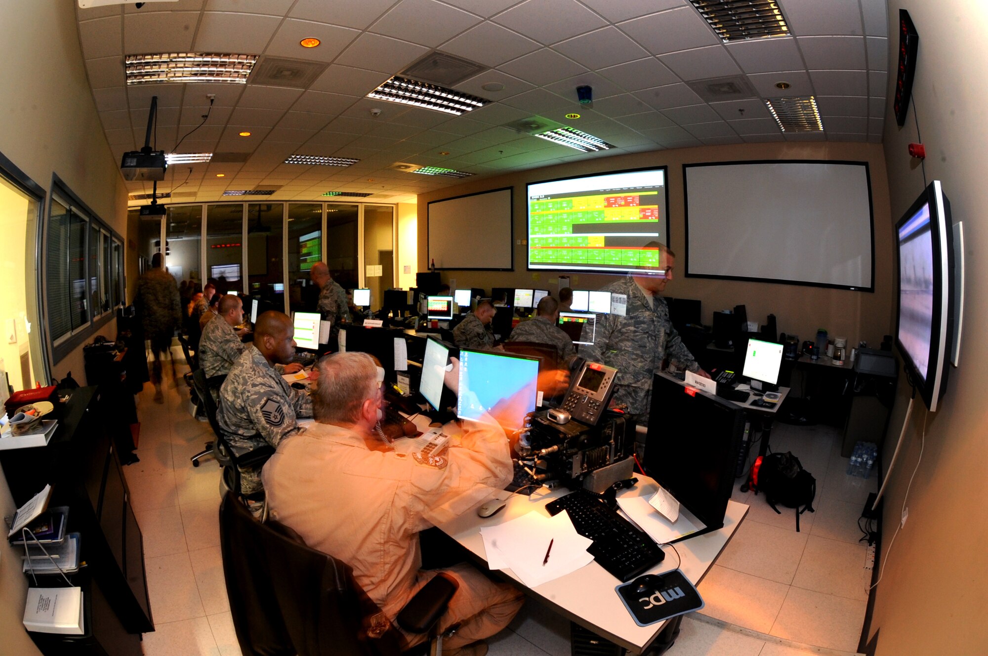 The 379th Expeditionary Maintenance Operations Squadron runs the Maintenance Operations Center which stays busy constantly with personnel updating the status of aircraft assigned and directing the flow of maintenance which keeps them mission capable in this undisclosed location in Southwest Asia, Jan 20, 2009.  Each deployed unit has representatives in the MOC to handle the aircraft for their particular unit. All of these Airmen are deployed from various bases around the world in support of Operations Iraqi and Enduring Freedom and Joint Task Force-Horn of Africa.  (U.S. Air Force Photo by Staff Sgt. Joshua Garcia/Released)