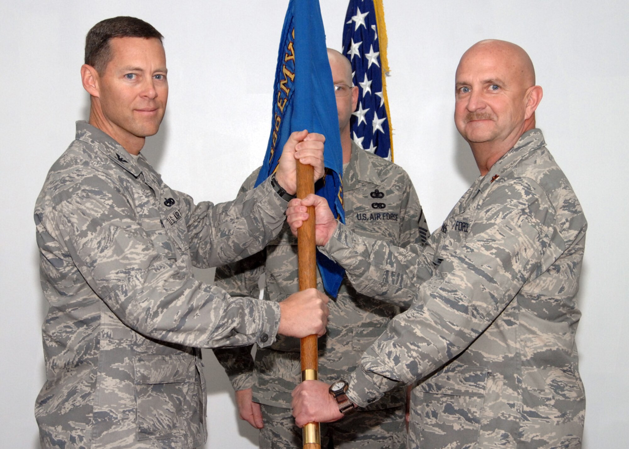 SOUTHWEST ASIA -- Maj. Jay Johnson receives command of the 386th Expeditionary Maintenance Squadron from Col. Herbert Phillips, 386th Expeditionary Maintenance Group commander, at an air base in Southwest Asia, Jan. 22. (U.S. Air Force photo/Senior Airman Courtney Richardson)