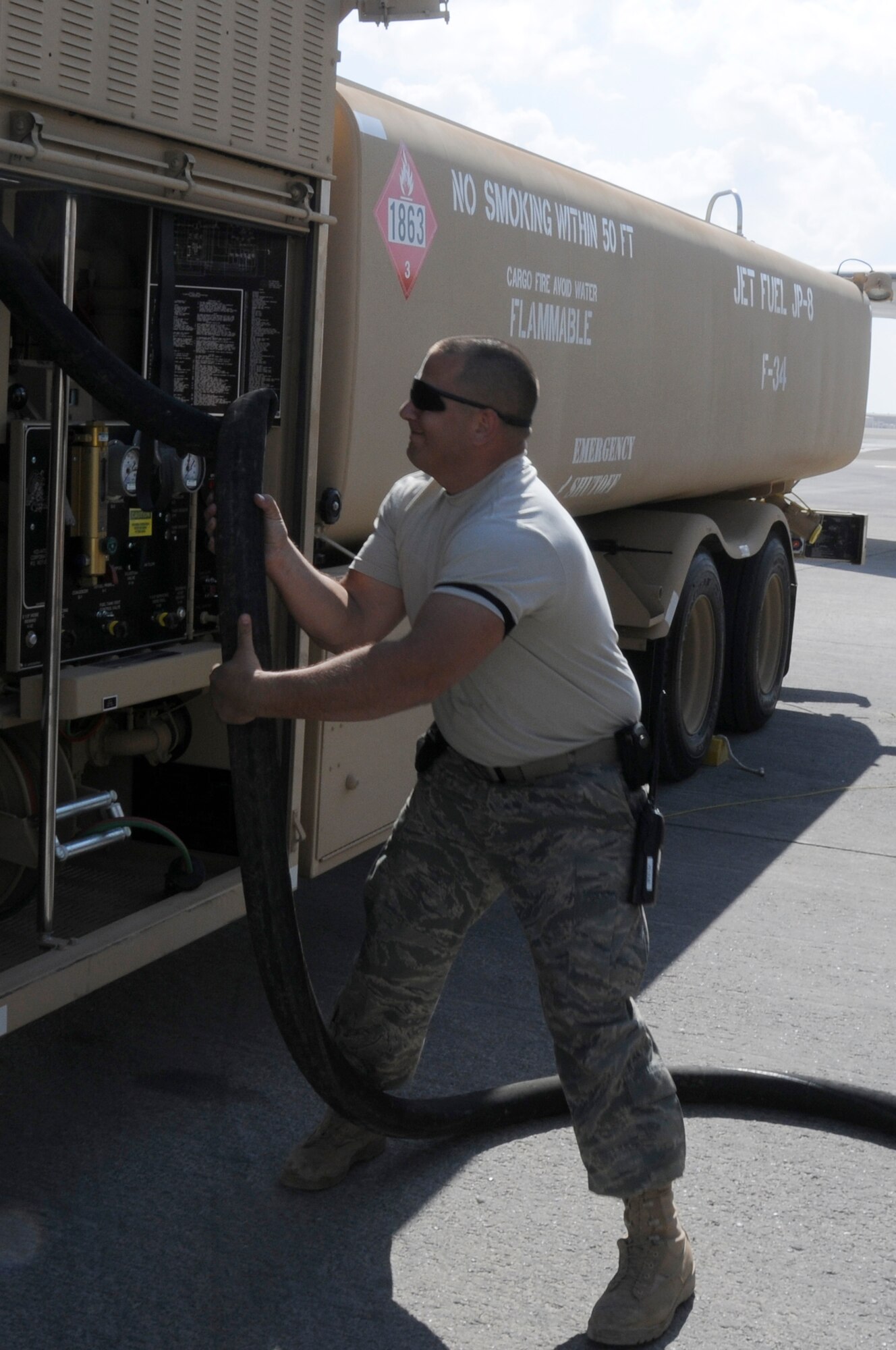 SOUTHWEST ASIA -- Staff Sgt. Joshua Schubert, 380th Expeditionary Logistics Readiness Squadron distribution supervisor straightens the hose on an R-11 6,000 gallon fuel truck, Jan 21. Sergeant Schubert was assisting during a refueling of an E-3 Sentry. Sergeant Schubert performs checks at random to ensure proper procedures are followed during aircraft refueling. Sergeant Schubert is deployed from Eglin AFB, Fla. and is from Hatboro, Pa. (U.S. Air Force photo by Senior Airman Brian J. Ellis) (Released)