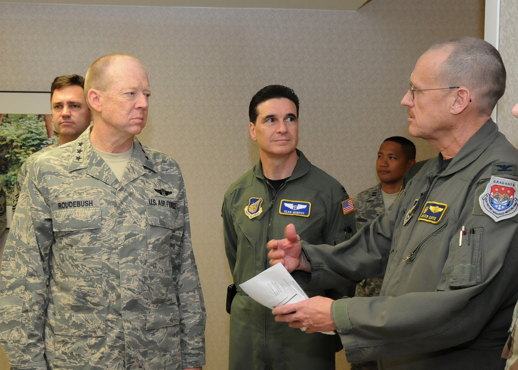 ANDERSEN AIR FORCE BASE, Guam - Colonel 
Walter Cayce, 36th Medical Group commander briefs Lt. Gen. James Roudebush, U.S. Air Force Surgeon General on the capabilities and services provided by the 36th MDG during a site visit here Jan. 23. (U.S. Air Force photo by Senior Airman Nichelle Griffiths)