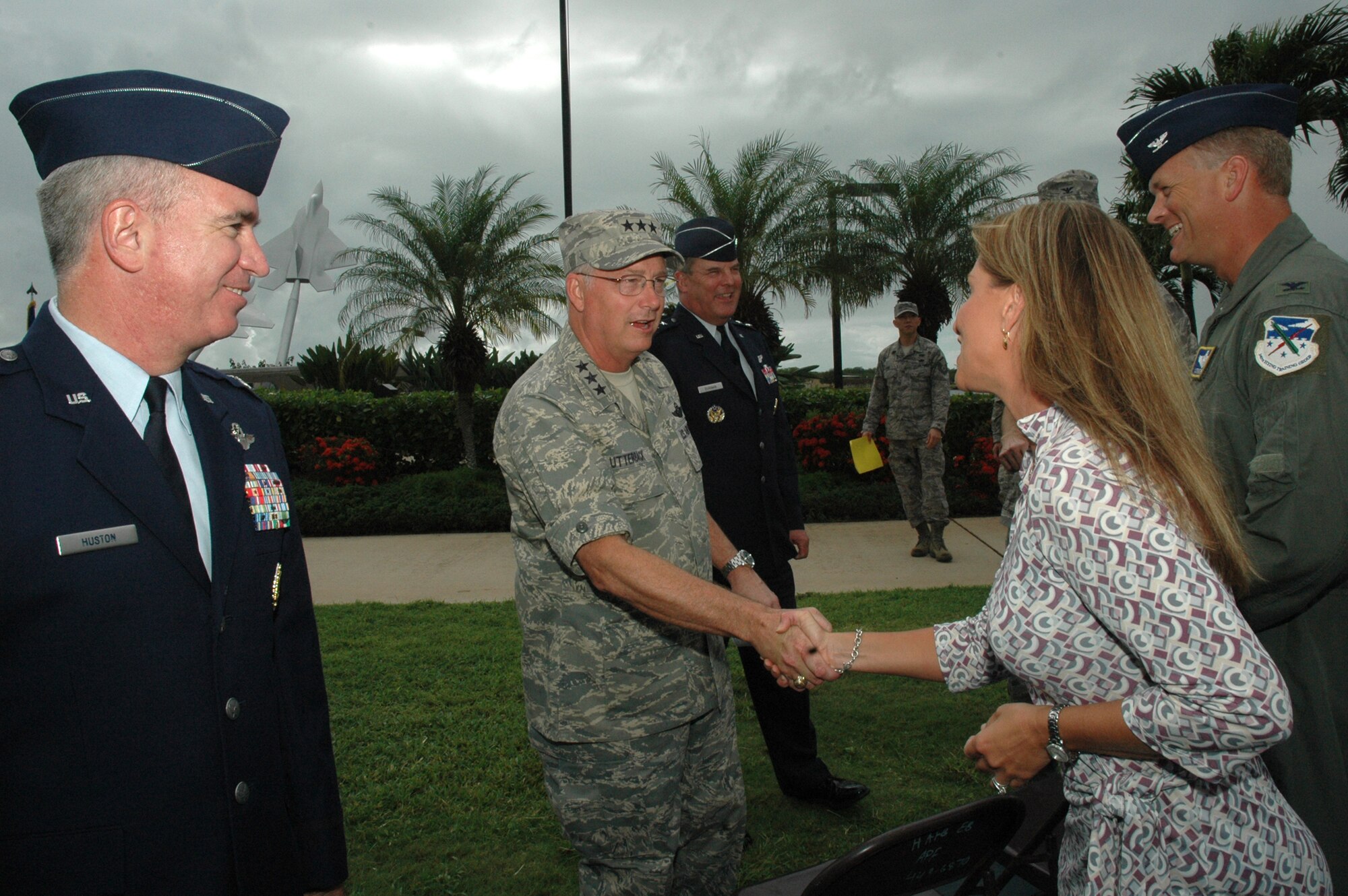 Lt. Gen. Loyd "Chip" Utterback, 13th Air Force commander, and Col. Robert Huston, 624th Regional Support Group commander, greet guests after the assumption of command ceremony Jan. 10 at Hickam Air Force Base, Hawaii. Prior to assuming command of the 624th RSG, Colonel Huston worked as the Reserve advisor to General Utterback. Colonel Huston's responsibility as commander of the 624th RSG is managing the largest Air Force Reserve presence in the Pacific, which is comprised of five units in Hawaii and Guam. The group provides the combatant commander more than 650 combat-ready Airmen who specialize in aerial port, aeromedical staging and civil engineering operations for worldwide employment. (Air Force photo/Master Sgt. Daniel Nathaniel)