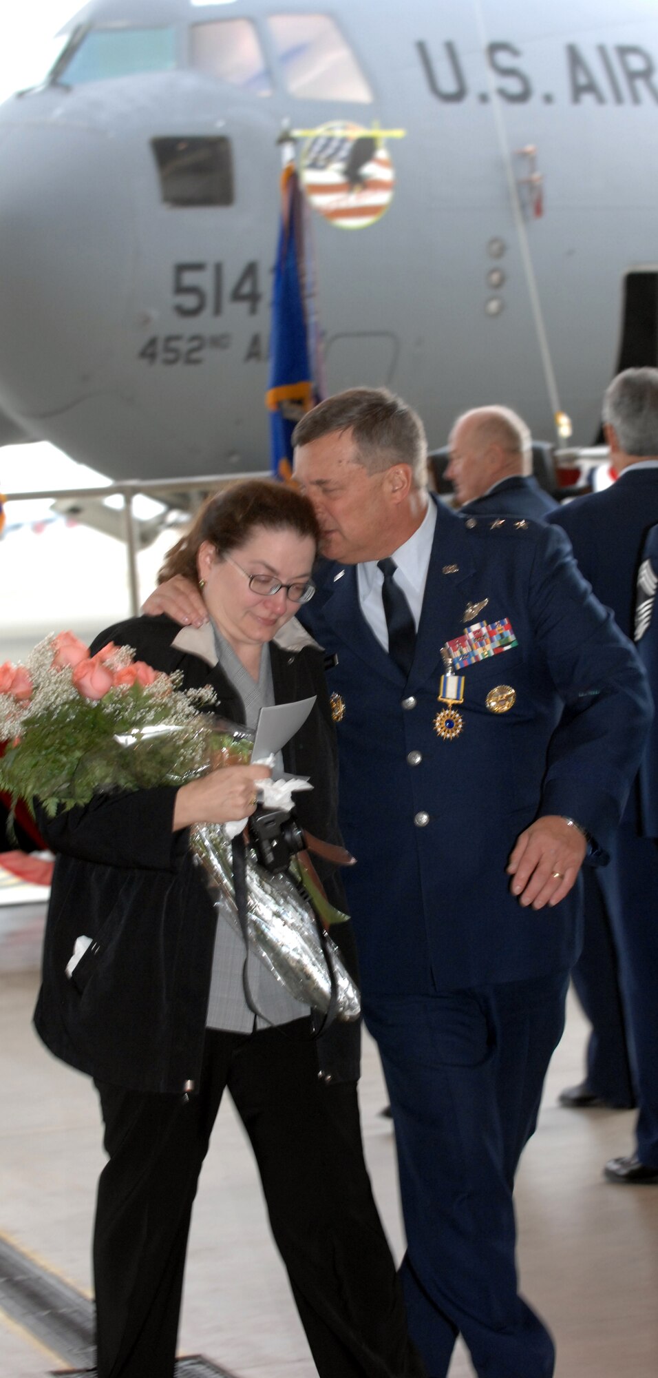 Ms. Karen Petruskevich and her husband, Maj. Gen. Robert E. Duignan, share an emotional moment as they depart March ARB, Calif. after his retirement ceremony and change of command, Jan. 25, 2009.  Brig. Gen. Eric Crabtree assumed command of Headquarters 4th Air Force at the change of command ceremony.  (U.S. Air Force courtesy photo) (released)