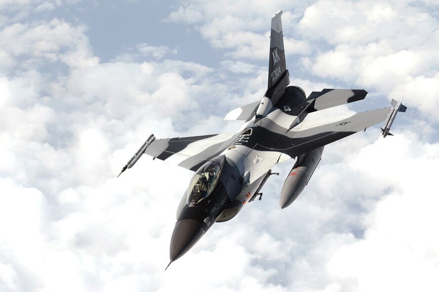 An F-16 Fighting Falcon flies over the Pacific Jan. 23, 2009. The F-16 is part of the 18th Aggressor Squadron at Eielson Air Force Base, Alaska. Ten Aggressor jets and associated personnel are deployed to Kadena Air Base, Japan until the end of January to provide adversary tactics training to 18th Wing aircrews.  (U.S. Air Force photo/Airman 1st Class Chad Warren) 