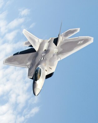 An F-22 Raptor flies above Kadena Air Base, Japan during an air refueling mission Jan. 23, 2009. The F-22 is deployed from 27th Fighter Wing Langley Air Force Base, Va. in support of U.S. Pacific Command. (U.S. Air Force photo/Airman 1st Class Chad Warren)