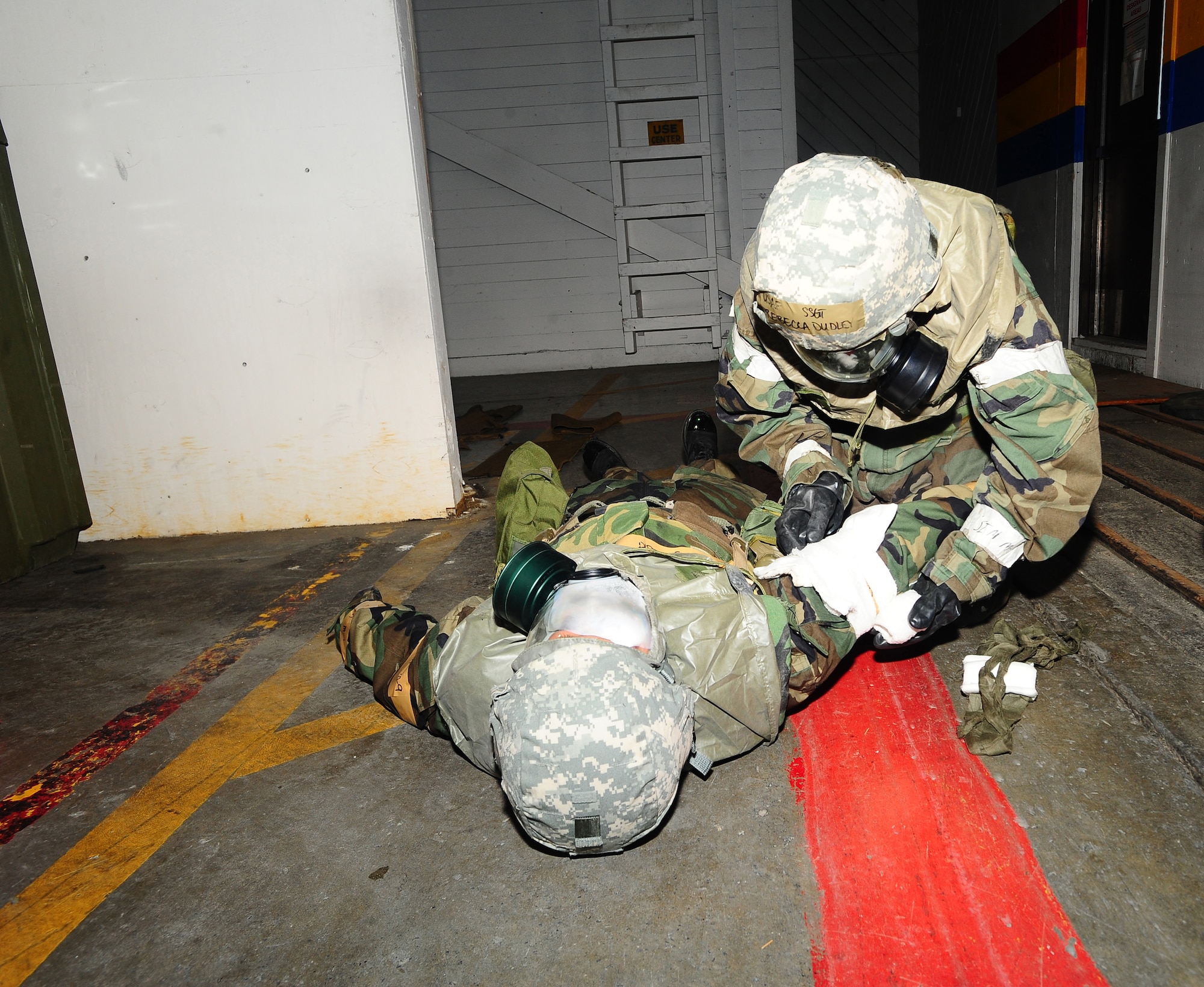 ELMENDORF AIR FORCE BASE, Alaska--Staff Sgt. Rebecca Dudley, 3rd Medical Operations Squadron, bandages Airman First Class Amber Pujanauski, also of 3rd MDOS, Jan. 21. SSgt Dudleyand and A1C Pujanauski particpated in Polar Force Exercise 09-2 in preparation for an upcoming Operation Readiness Inspection.   (U.S. Air Force photo/Airman First Class Kristin High)