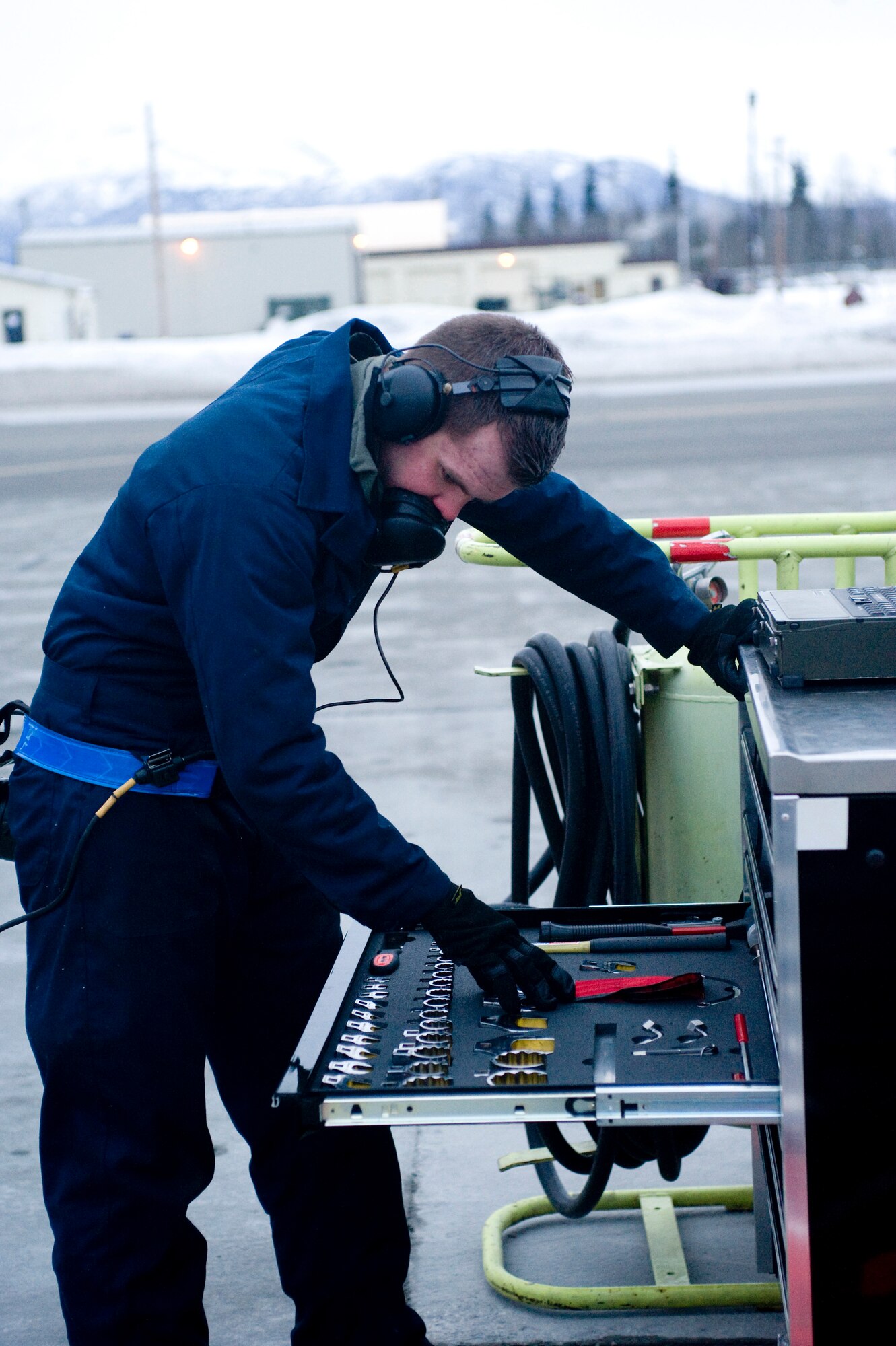 ELMENDORF AIR FORCE BASE, Alaska-- Airman First Class Spencer Parker, 3rd Aircraft Maintenance Squadron, accounts for his tools before sending an F-22 Raptor from the 525th Fighter Squadron on its way to Nellis Air Force Base for Red Flag Jan. 23. Red Flag is an aerial combat training exercise designed to provide a realistic training environment for U.S. military branches and allies (U.S. Air Force photo/Senior Airman Jonathan Steffen)