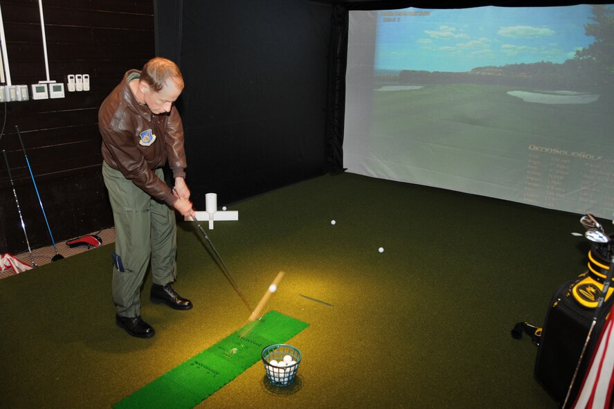 MISAWA AIR BASE, Japan -- Col. David Stilwell, 35th Fighter Wing commander, tries out the Dead Solid Golf Simulator Jan. 21, 2009, at the Gosser Memorial Golf Course. Development of the golf course simulator began in November 2008. (U.S. Air Force photo by Senior Airman Jamal D. Sutter)