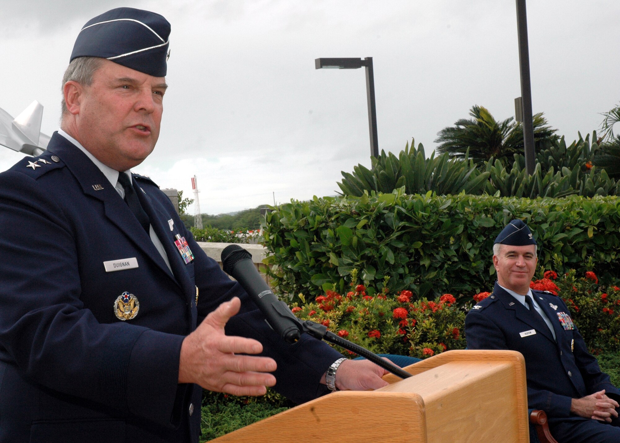Maj. Gen. Robert Duignan, 4th Air Force commander, makes comments just prior to transferring the 624th RSG guidon to Col. Robert Huston.  General Duignan was the guest speaker at the assumption of command ceremony Jan. 10 at Hickam Air Force Base, Hawaii. Colonel Huston's responsibility as commander of the 624th RSG is managing the largest Air Force Reserve presence in the Pacific, which is comprised of five units in Hawaii and Guam.  The group provides the combatant commander more than 650 combat-ready Airmen who specialize in aerial port, aeromedical staging and civil engineering operations for worldwide employment. (Air Force photo/Master Sgt. Daniel Nathaniel)