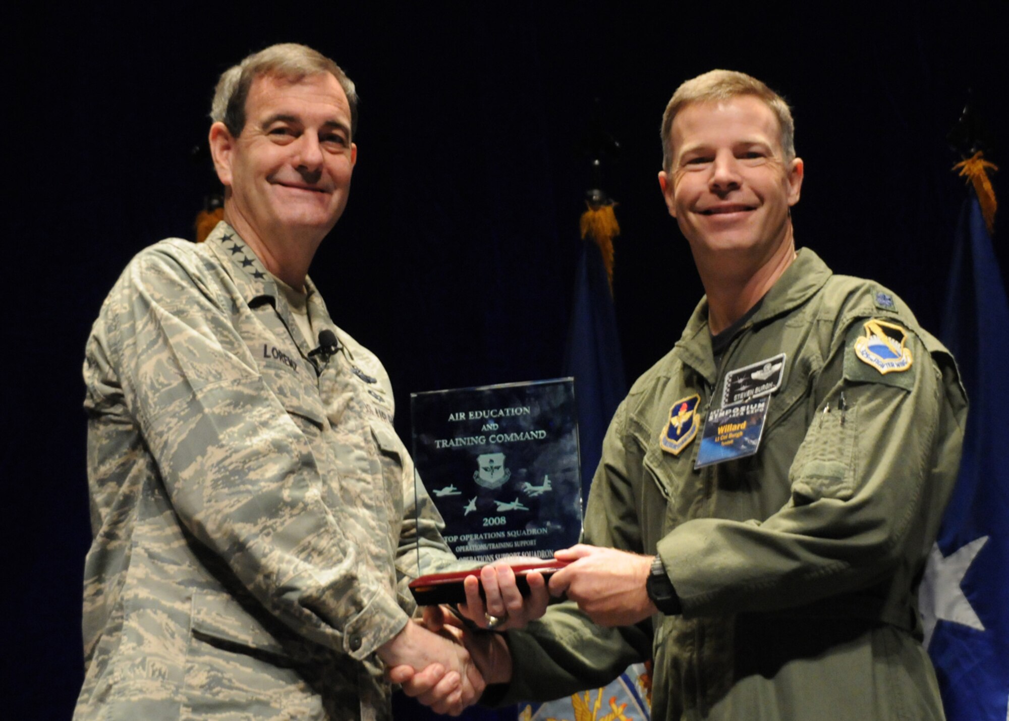 Lt. Col. Steven Burgh, 325th Operations Support Squadron commander, receives the “Top Operations Award” from Gen. Stephen Lorenz, Air Education and Training Command commander, recently at the AETC Symposium in San Antonio.  The 325th OSS also received the “Top Operations and Training Support Squadron Award.”
Courtesy photo