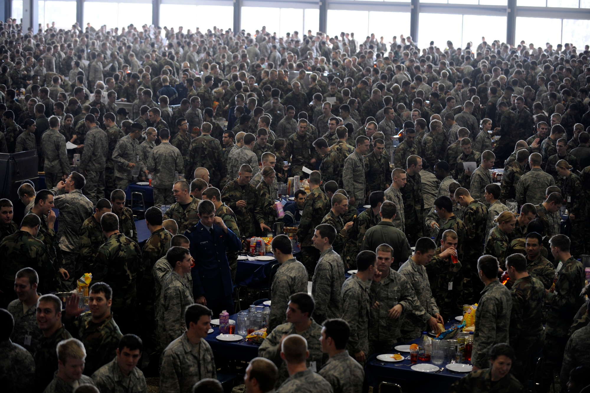 Cadets stand beside their chairs Jan. 23 as they wait for the rest of the approximately 4450 cadets to enter Mitchell Hall Cadet Dining Facility at the U.S. Air Force Academy in Colorado Springs, Colo. so they can begin lunch. The dining facility feeds approximately 4450 cadets and sits on 1.75 acres. (U.S Air Force photo/Staff Sgt. Desiree N. Palacios)