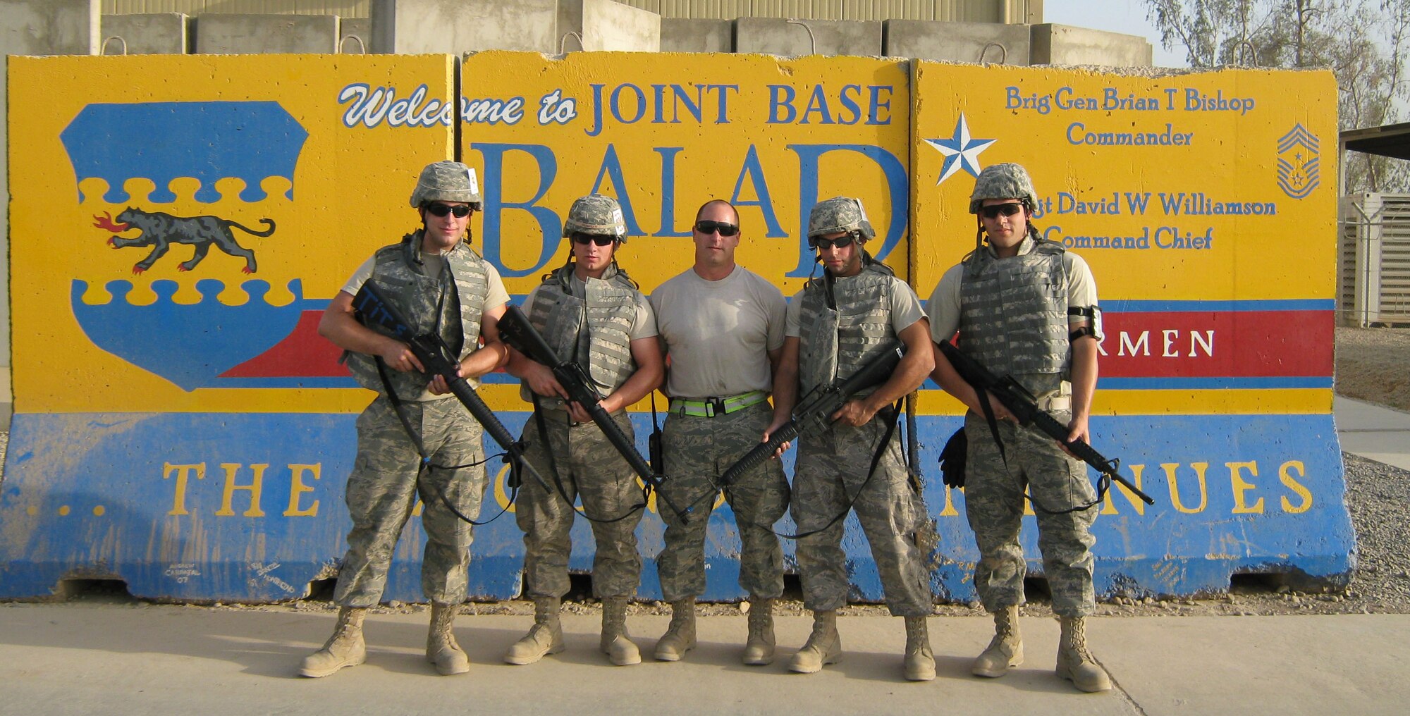 BALAD BUNCH -- Deployed aerial port members pause for a recent photo at Joint Base Balad. They are, from left, Senior Airman Alan Eckert, Niagara Falls Air Reserve Station, N.Y,; and Staff Sgt. Kristopher Grimshaw, Master Sgt. Dan Lawlor, Staff Sgt. Anthony Racco, and Senior Airman Christopher Stanzione, all from Westover's 42nd Aerial Port Squadron. (Courtesy photo)