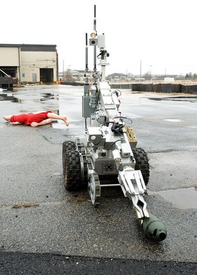 Explosive Ordnance Disposal Airmen utilize a robot to secure an un-exploded ordinance during a Major Accident Response Exercise on Dover Air Force Base recently. In Delaware alone, the 436th Civil Engineer Squadron’s EOD flight recovered more than 1,200 ordnance items and was lauded by the Delaware State Police for this contribution.   (U.S. Air Force photo/Tom Randle)