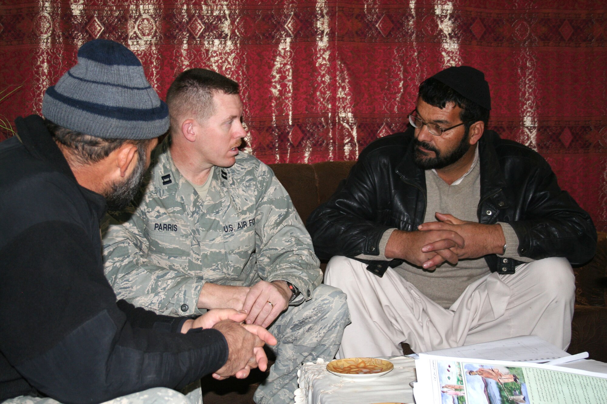 Capt. James Parris meets with Dr. Nadir Noori (right), Paktya's director of public health, recently to discuss numerous health projects. Captain Parris is the Provincial Reconstruction Team Paktya's director of medical plans. (U.S. Air Force photo/Capt. Stacie N. Shafran)

