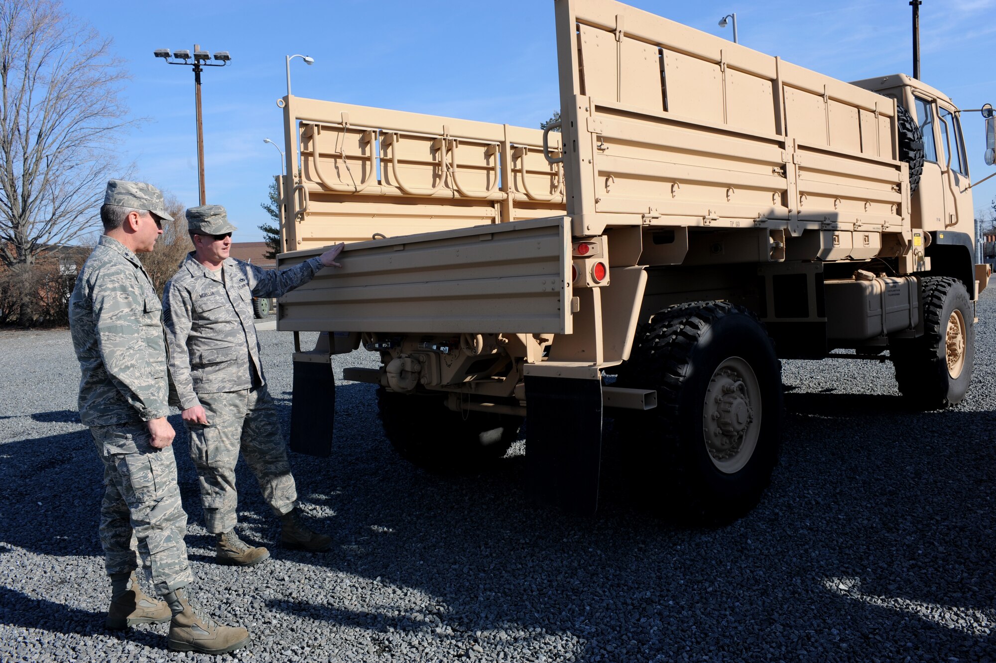 Tech. Sgt. Scott Mueller, Expeditionary Operations School, shows one of the new Light Medium Tactical Vehicles to Maj. Gen. Kip Self, U.S. Air Force Expeditionary Center commander, at Fort Dix, NJ, Jan. 23.  The Expeditionary Center vehicle fleet will include 11 LMTV’s with a 2.5-ton capacity replacing the M35 half-ton trucks.  (U.S. Air Force Photo/Staff Sgt. Nathan Bevier)
