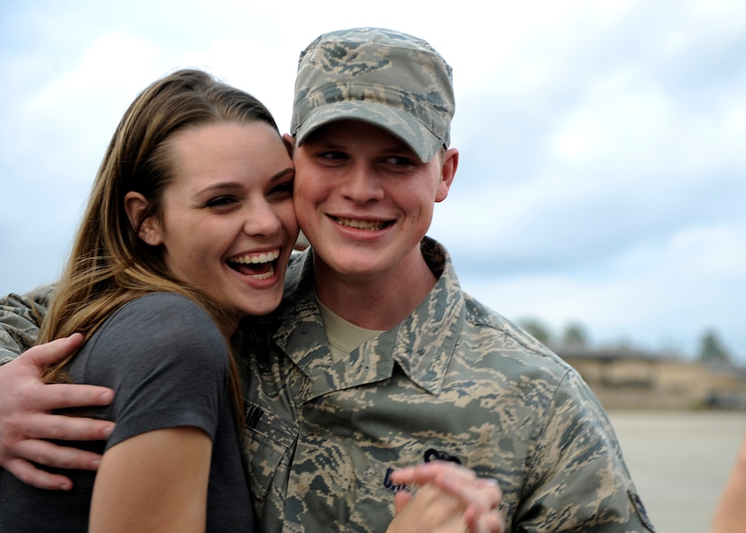 MOODY AIR FORCE BASE, Ga. -- Senior Airman Bryan Martin, 823rd Security Forces Squadron member, and his wife Kristen, stop for an interview by a local news station here Jan. 24. The 823rd SFS arrived home after serving during a deployment to Iraq. (U.S. Air Force photo by Senior Airman Brittany Barker)