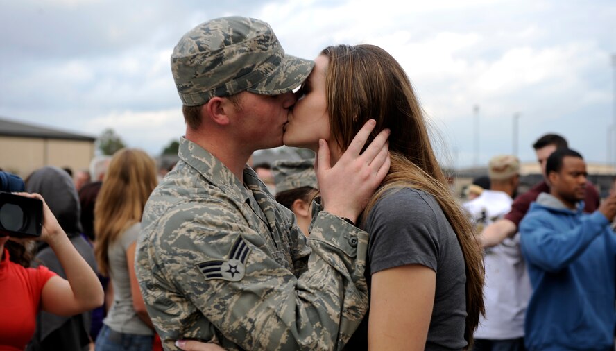 MOODY AIR FORCE BASE, Ga. -- Senior Airman Bryan Martin, 823rd Security Forces Squadron member, kisses his wife Kristen here Jan. 24. Airman Martin arrived home after serving during a deployment to Iraq. (U.S. Air Force photo by Senior Airman Brittany Barker)