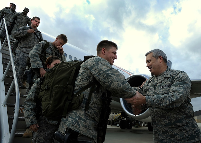 MOODY AIR FORCE BASE, Ga. -- Brig. Gen Michael Longoria, 93rd Air Ground Operations Wing commander, shakes the hand of a returning member of the 823rd Security Forces Squadron here Jan. 24. The 823rd SFS arrived home after serving during a deployment to Iraq. (U.S. Air Force photo by Senior Airman Brittany Barker)