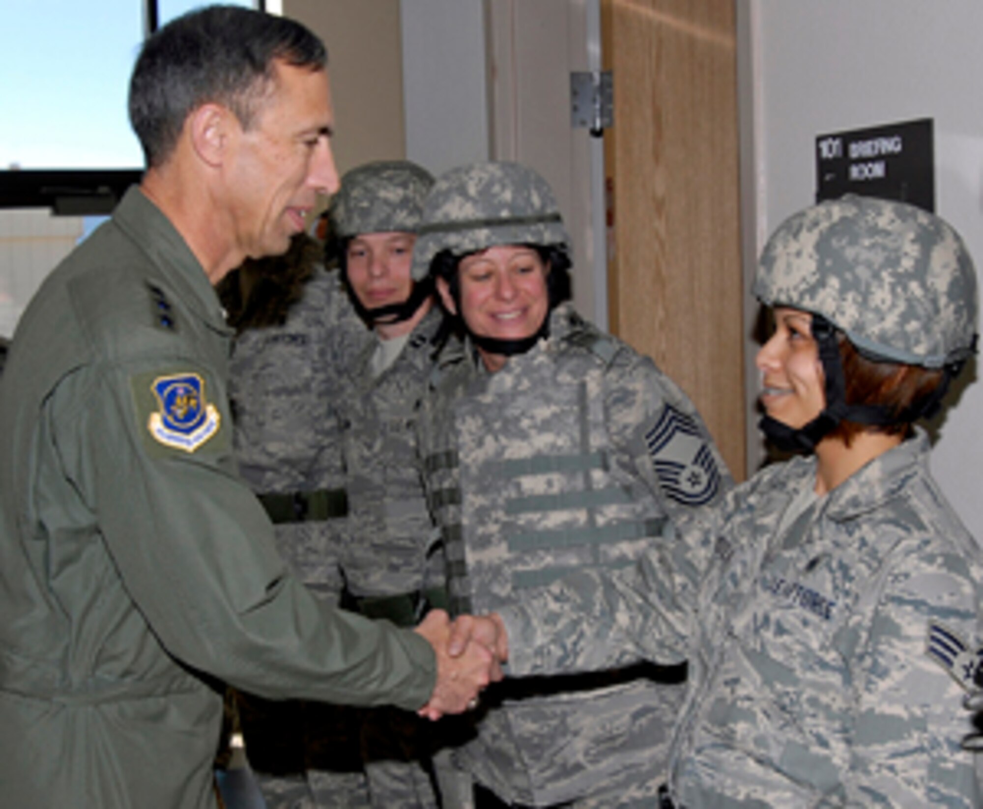 Lt. Gen. Larry James is greeted by Senior Airman Kelani Mendiola who recently returned from CJTF-82 (Craig Joint Theater Hospital), Bagram Air Base, Afghanistan, after a five month deployment. 