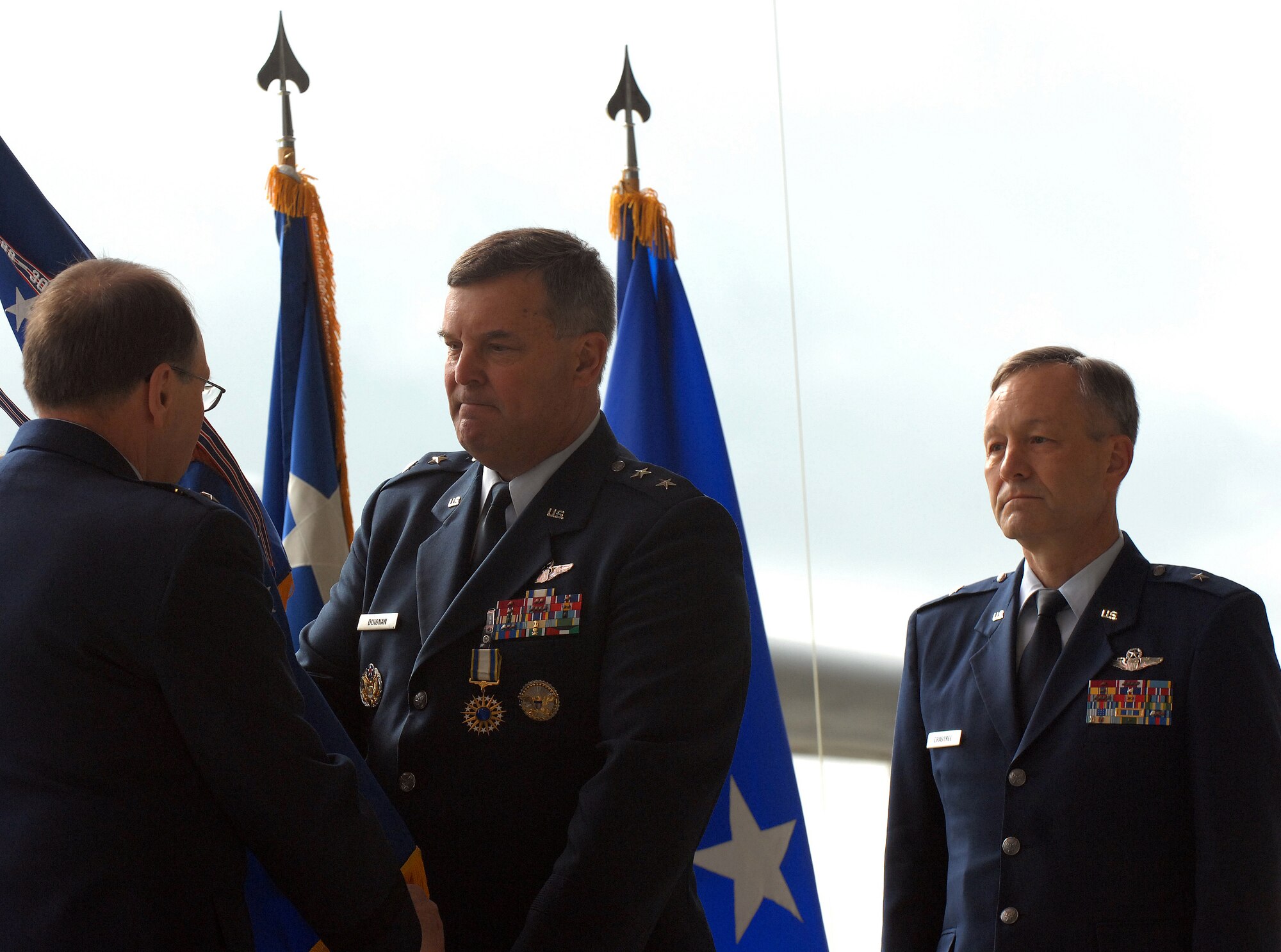 Lt. Gen. Charles E. Stenner Jr., left, commander of Air Force Reserve Command, receives the 4th Air Force command flag from Maj. Gen. Robert E. Duignan as Brig. Gen. Eric. W. Crabtree stands by to accept command of the numbered air force. General Duignan relinquished his command and retired during ceremonies at March Air Reserve Base, Calif., Jan. 25, 2009. (U.S. Air Force photo/Tech. Sgt. Tech. Sgt. Joselito Aribuabo)