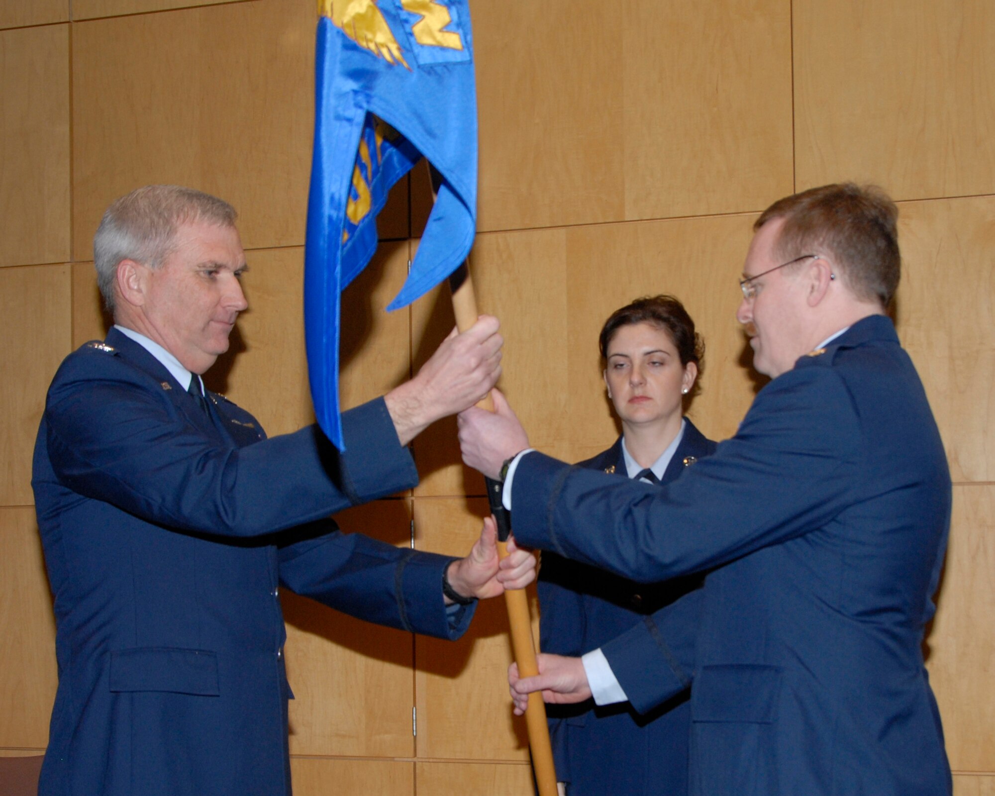Lt. Col. Brian Wyneken (right) receives the flag of command for the 109th Airlift Squadron, Minnesota Air National Guard, from 133rd Operations Group Commander, Col Bob Cayton during a ceremony at the St. Paul Air National Guard base on January 25, 2009. (USAF photo by Tech. Sgt. John Wiggins) 