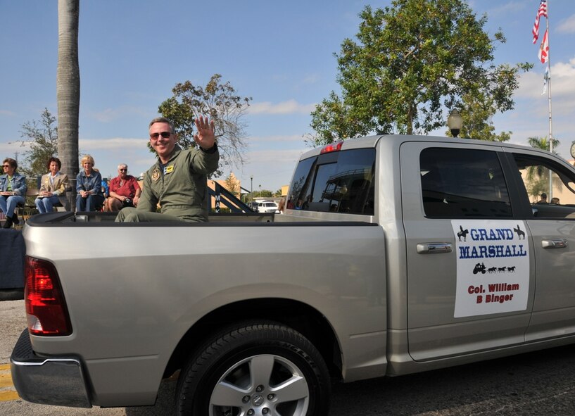 Col. William Binger, 482nd Fighter Wing commander, waves to the crowd while serving as Grand Marshal during the Homestead Rodeo Parade on Jan. 24. It was the 60th anniversary of the parade, which has been held almost as long as military operations from the City of Homestead. The annual rodeo and parade promote the sport of rodeo and other equestrian activities for the benefit of the Greater Homestead and Florida City community. (U.S. Air Force photo/Tim Norton)