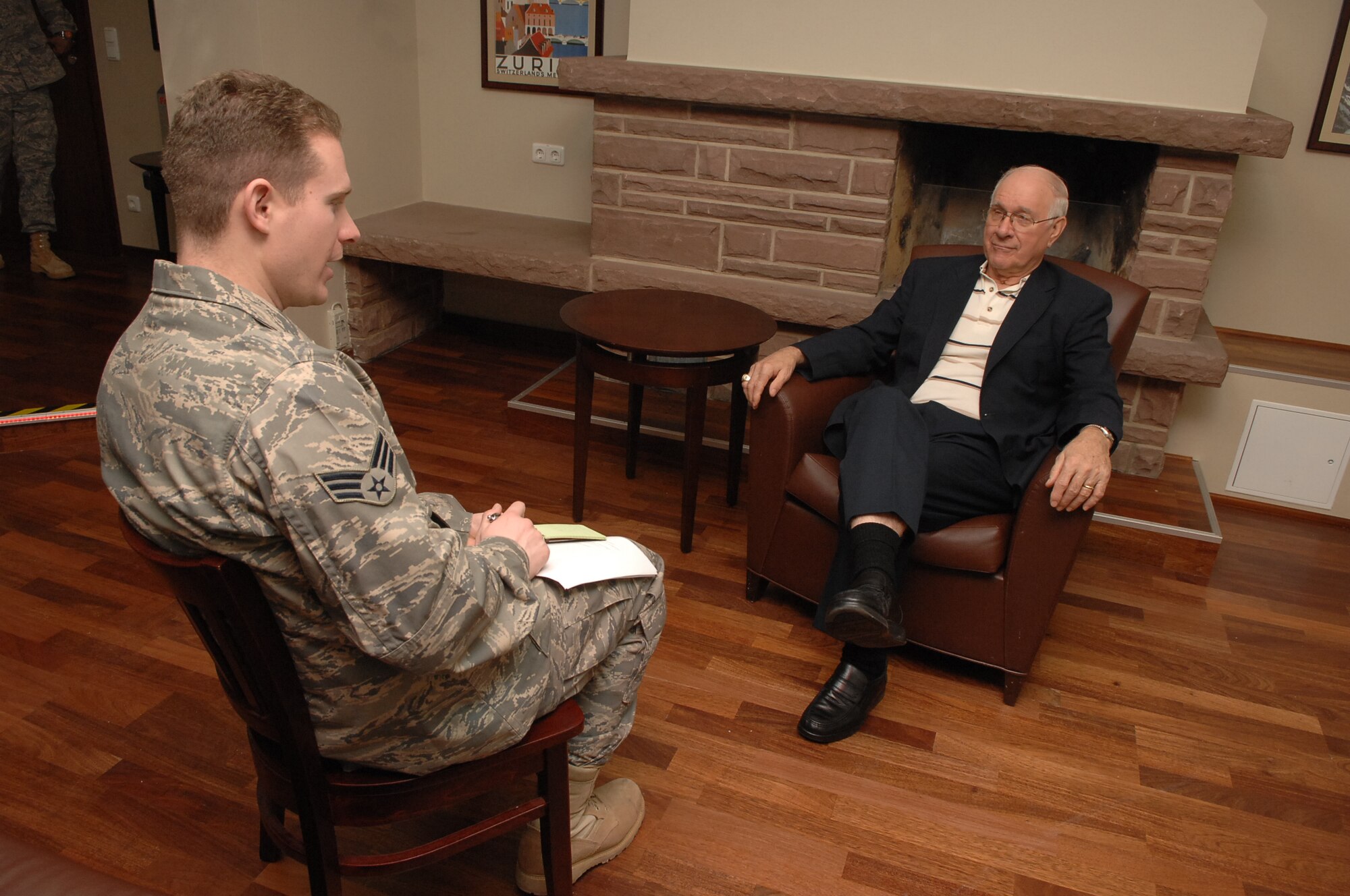 SPANGDAHLEM AIR BASE, Germany -- Senior Airman Clayton Murray, 52nd Fighter Wing Public Affairs, interviews Sam Parish, 8th Chief Master Sgt. of the Air Force, after his tour of base facilities January 21, 2009.  Chief Parish spoke to the 52nd Fighter Wing members about the past, present, and future of the Air Force.  (U.S. Air Force photo by Airman 1st Class Nicholas Wilson)