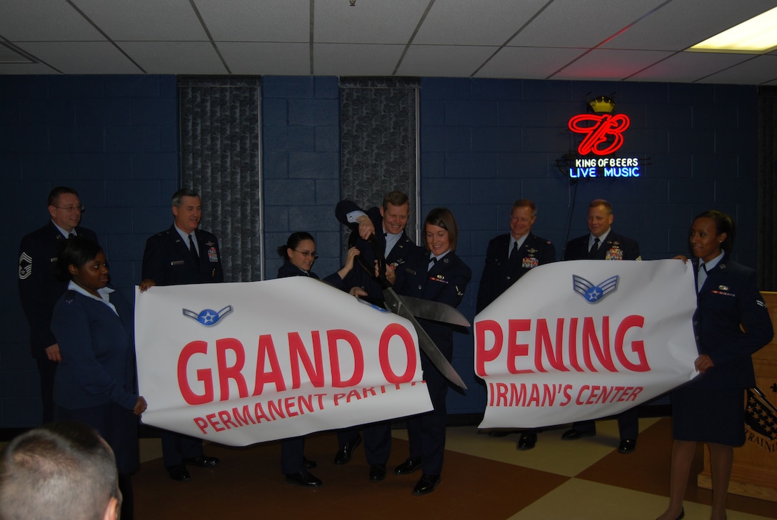 Colonel Richard Lipsey (center), 82nd Mission Support Group commander, Airman 1st Class Alexandria Verissimo and Airman 1st Class Patricia Lieblein open the new permanent-party Airman's center January 21.  (U.S. Air Force Photo by Staff Sgt. Vernon J. Cunningham)