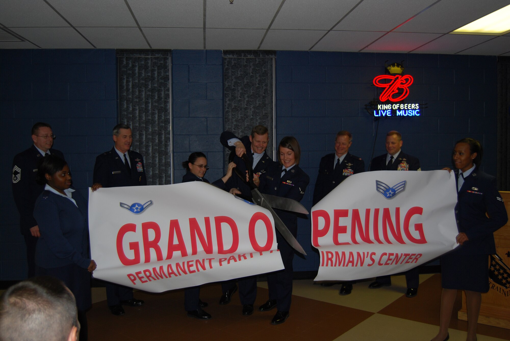 Colonel Richard Lipsey (center), 82nd Mission Support Group commander, Airman 1st Class Alexandria Verissimo and Airman 1st Class Patricia Lieblein open the new permanent-party Airman's center January 21.  (U.S. Air Force Photo by Staff Sgt. Vernon J. Cunningham)