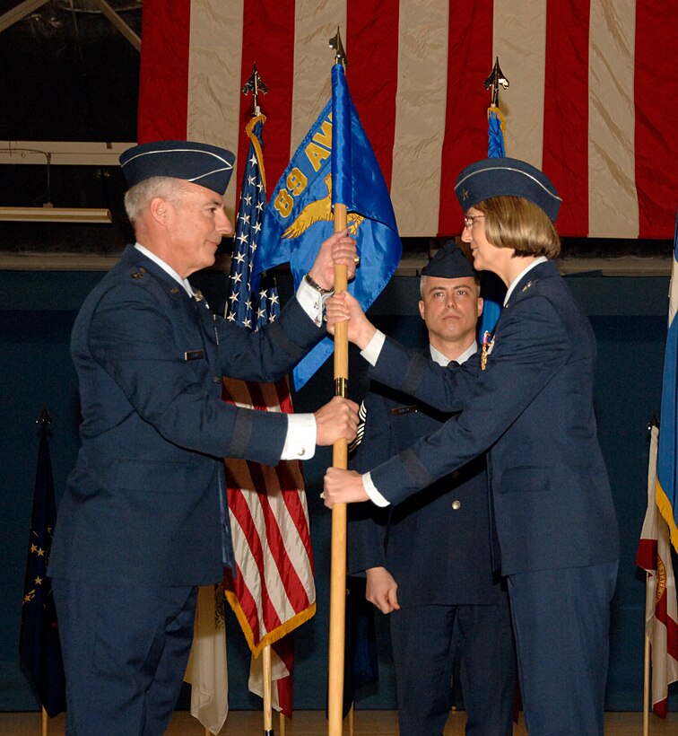 Brig. Gen. Margaret H. Woodward relinquishes command of the 89th Airlift Wing to Maj. Gen. Winfield W. Scott III, commander of the 18th Air Force at Scott AFB, Ill., Jan. 23 in Hanger 3. Brig. Gen. Woodward will become the vice commander of the 18th Air Force at Scott AFB. (U.S. Air Force photo by Airman 1st Class Melissa V. Rodrigues)