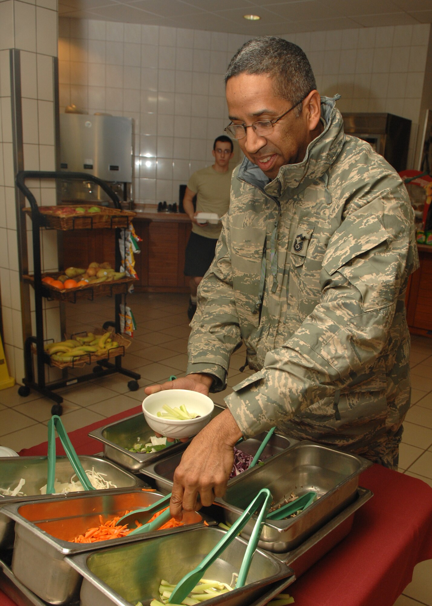 SPANGDAHLEM AIR BASE, Germany -- Senior Master Sgt. Louis Suarez, 52nd Civil Engineer Squadron, selects an assortment of vegetables for his Mongolian dish, Jan. 22, 2008. Every month the Mosel Dining Facility allows customers to pick their own meat and vegetables to be stir fried as part of “Mongolian at the Mosel.”  The next event will be held Feb. 18 and is free for meal-card holders and $5.65 for those paying cash. (U.S. Air Force photo by Airman Staci Miller)