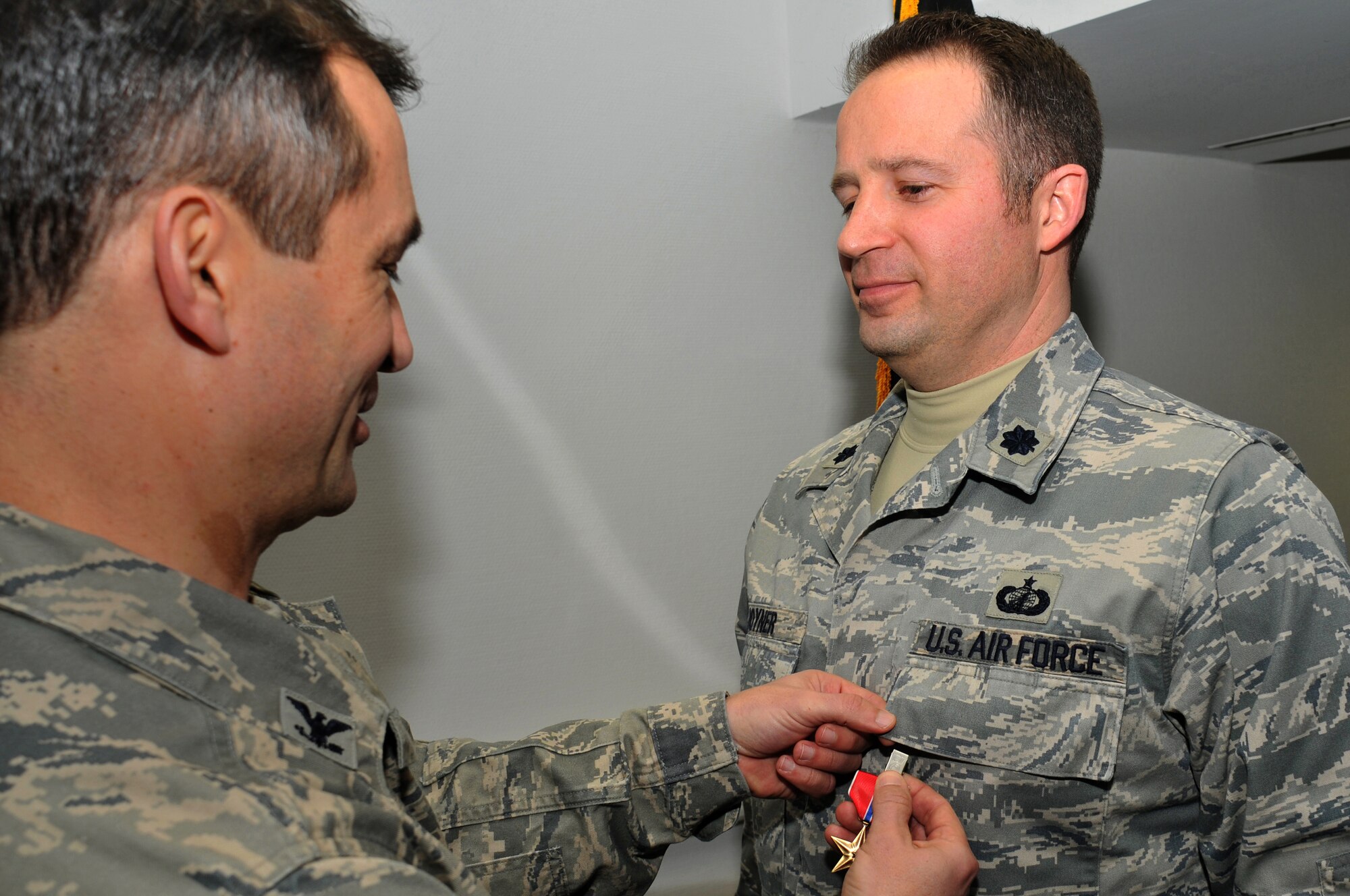 Lt. Col. Todd Joyner, 700th Contracting Squadron commander, receives the Bronze Star Medal Jan. 21, 2009, at the Rhine Ordnance Barracks, Germany, from Col. Donald Bacon, 435th Air Base Wing commander, for his service in a combat zone with exposure to risk of hostile action during operation Iraqi Freedom. (U.S. Air Force photo by Senior Airman Nathan Lipscomb)