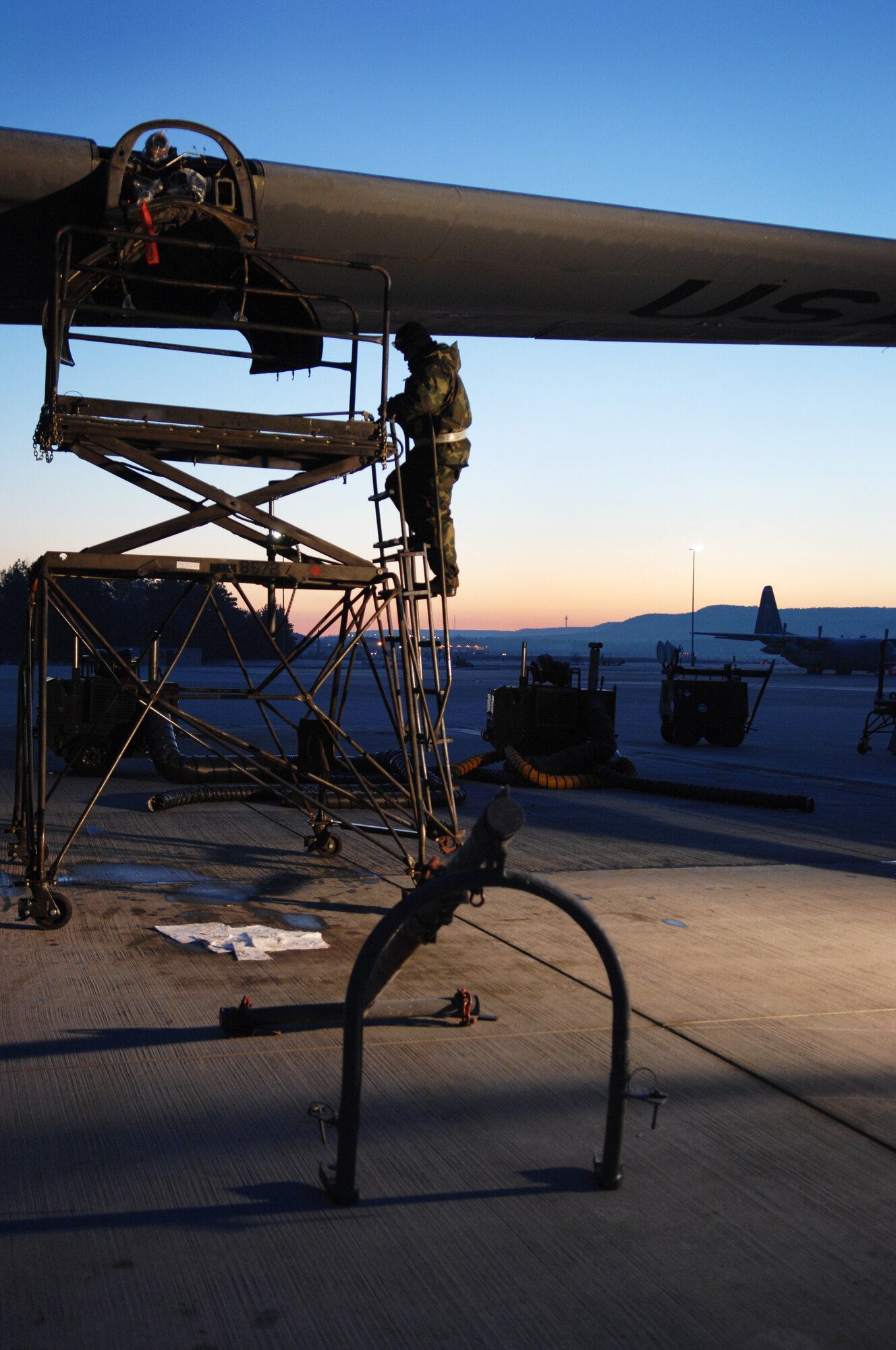 Senior Airman Jerry Tolbert, 86th Aircraft Maintenance Squadron, repairs an engine from a C-130 Hercules aircraft Jan. 22, 2009, at Ramstein Air Base. The maintainers start working early in the morning to get a jump-start on their aircraft. (U.S. Air Force photo by Senior Airman Amber Bressler)