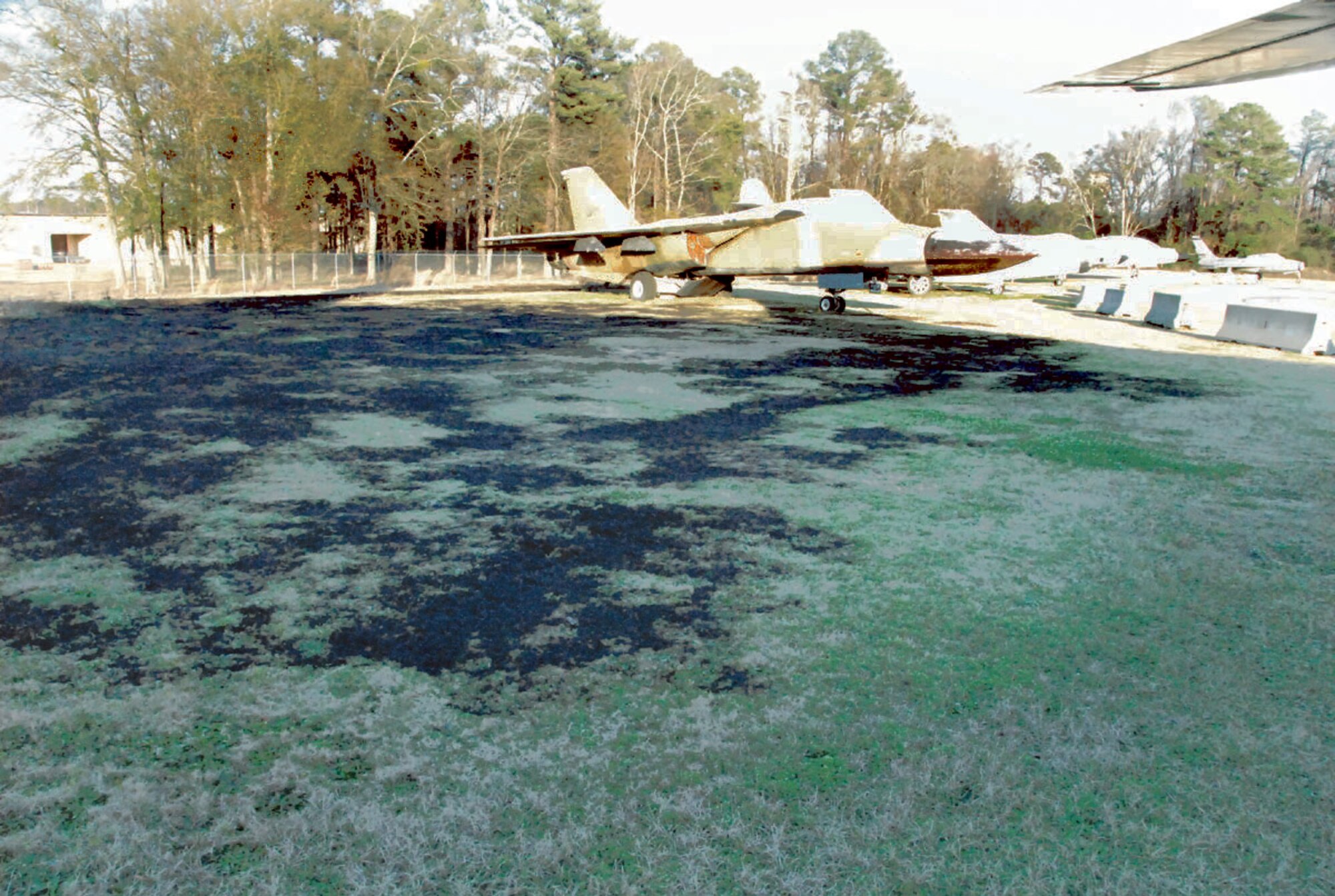 A brush fire by the Robins Parkway gate entrance was caused by burning cigarette ash. The fire spread near an aircraft display on the Museum of Aviation grounds.
U.S. Air Force photo by RAYCRAYTON