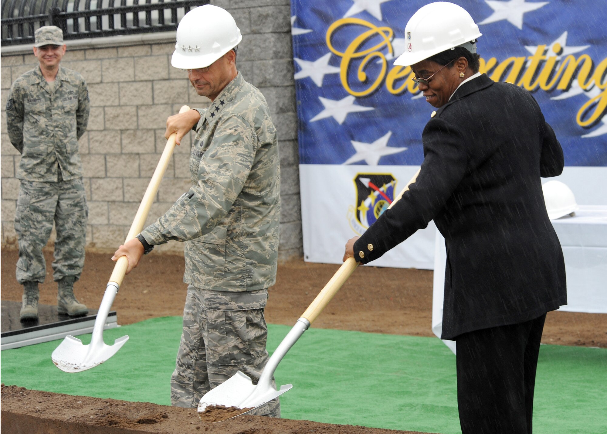 Lt. Gen. Tom Sheridan, Space and Missile Systems Center commander, and Dr. Wanda Austin, The Aerospace Corporation president and chief executive officer, break ground for the construction of a pedestrian overpass across El Segundo Boulevard, Jan. 26. The bridge will join Los Angeles Air Force Base and The Aerospace Corporation complex. Construction is expected to be complete early Spring of this year. (Photo by Atiba S. Copeland)