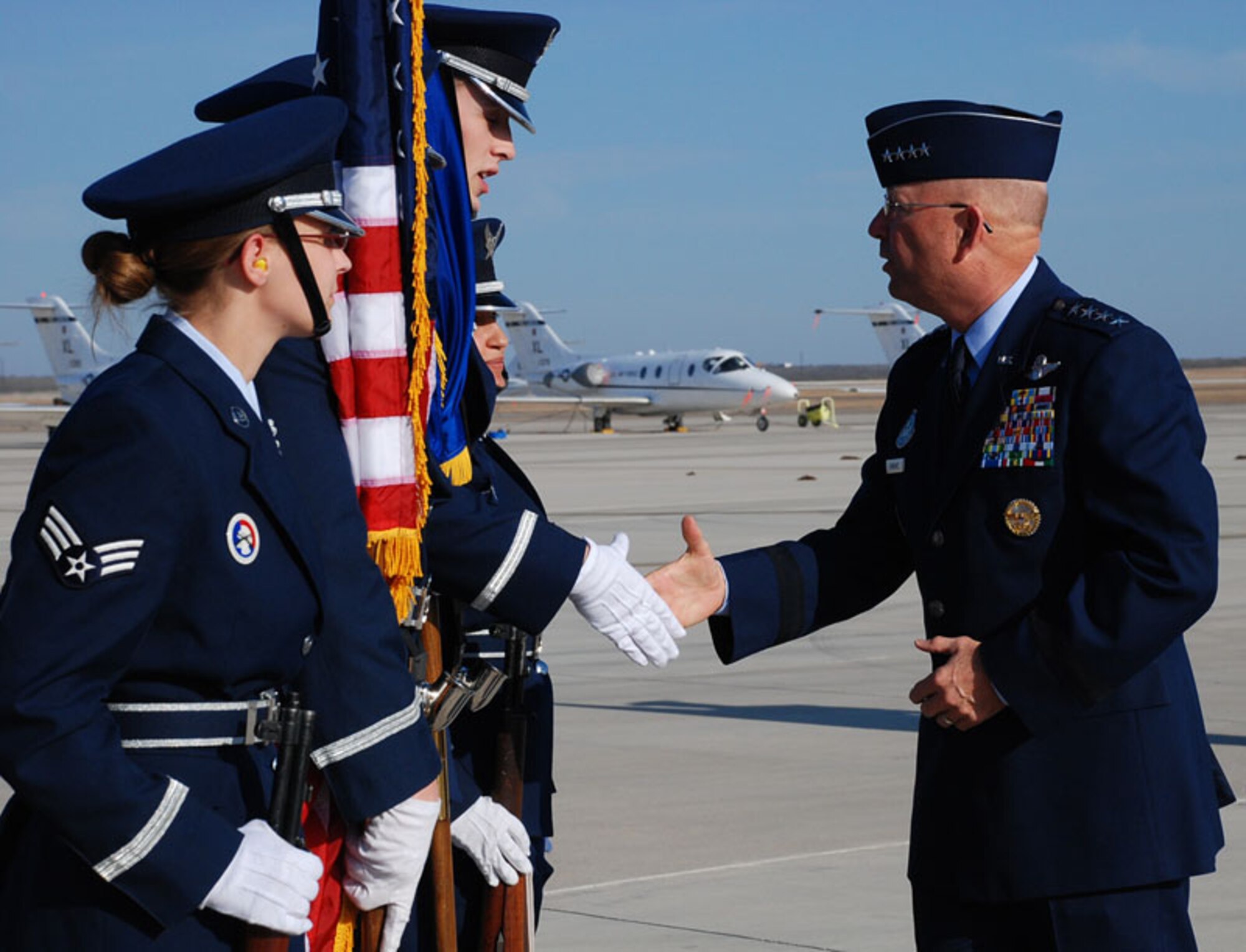 LAUGHLIN AIR FORCE BASE, Texas – General Victor E. Renuart, Jr., North American Aerospace Defense Command and U.S. Northern Command commander, talks to members form the Laughlin Honor Guard after arriving on Laughlin’s flight line Jan. 23. General Renuart came to Laughlin to give some words of wisdom to graduating class 09-04 as the guest speaker. (U.S. Air Force photo by Airman 1st Class Sara Csurilla)