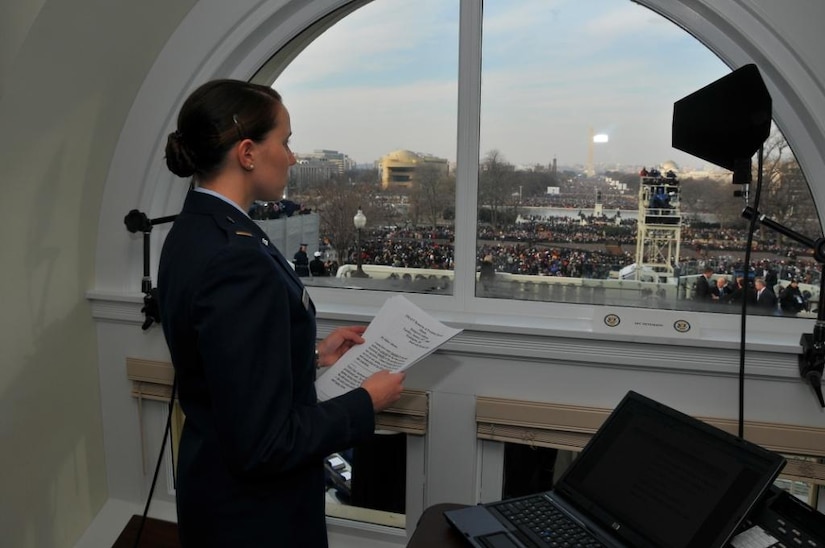WASHINGTON, D.C. -- Air Force 2nd Lt. Georganne Schultz, Armed Forces Inaugural Committee, looks out over the crowd gathered for the 56th Presidential Inauguration at the U.S. Capitol Jan. 20. More than 5,000 men and women in uniform provided military ceremonial support to the presidential inauguration, a tradition dating back to George Washington's 1789 inauguration.  (DoD photo/U.S. Air Force Senior Master Sgt. Thomas Meneguin).