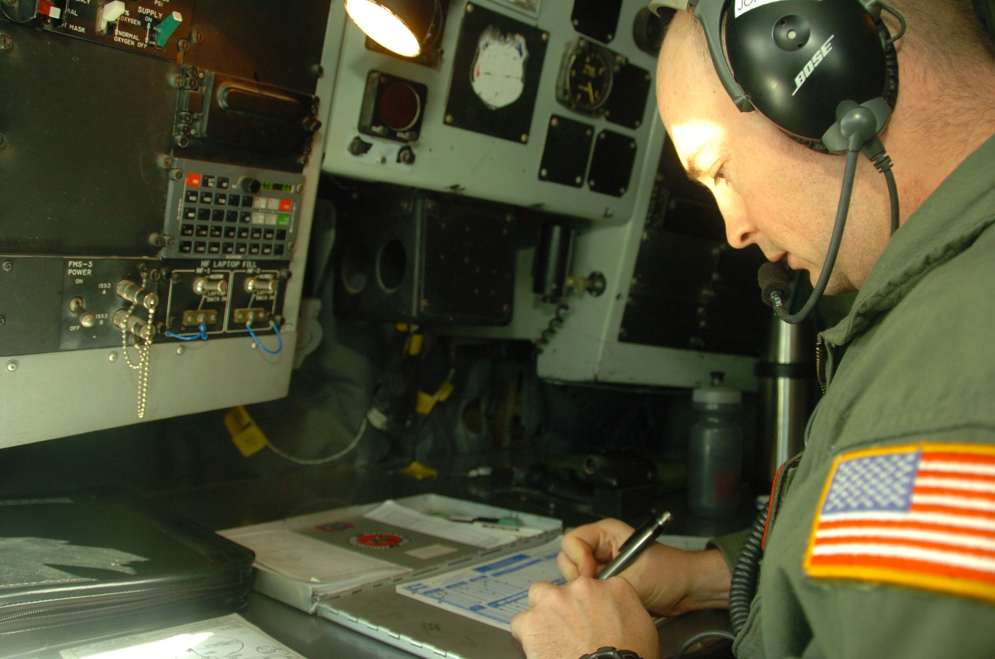 ALTUS AIR FORCE BASE, Okla.--Master Sgt. Justin Johansen of the 54th Air Refueling Squadron prepares for the landing of a KC-135 by documenting a pre-landing checklist. Sergeant Johansen assisted during a Crisis Communication Exercise Jan. 22. where newsgroups from Wichita Falls, Texas; Altus and Lawton had the opportunity to go in the boom pod and watch as the KC-135 refueled a C-17 Globemaster. (U.S. Air Force photo/ Airman 1st Class Leandra D. Hernandez)
