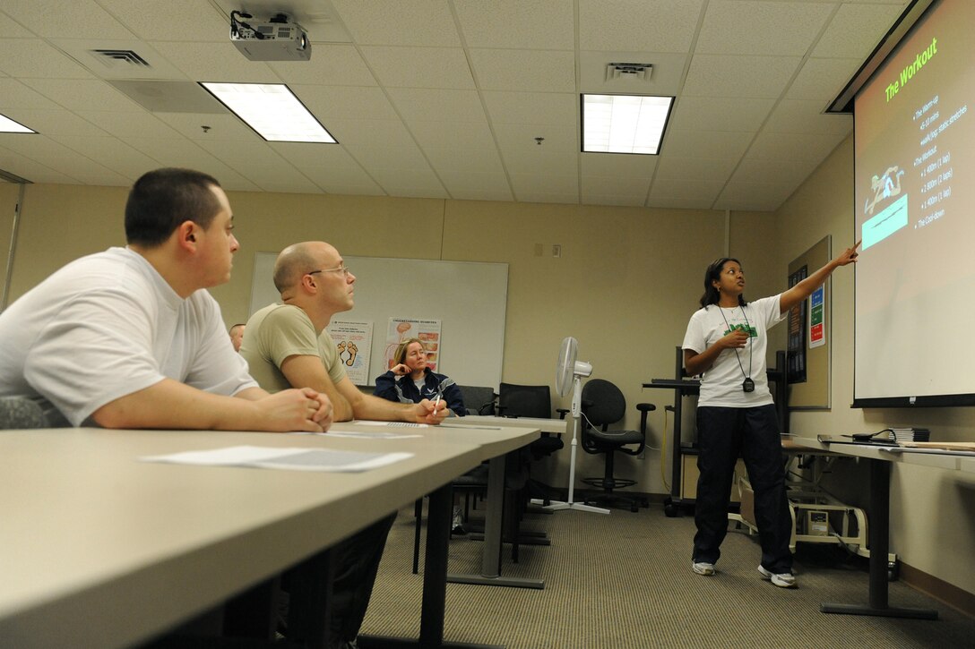LANGLEY AIR FORCE BASE, Va. -- Ms. Monica Cohen, 1st Force Support Squadron exercise physiologist, teaches Airmen the importance of proper running form during a running clinic classroom session Jan. 8.  The running clinic is a monthly session designed to help Airmen improve their 1.5 mile running time.  Participants of the clinic spend about three hours between the classroom and the track running.  The next running clinic will be held on Feb. 12, at the Health and Wellness Center, to sign up call 764-6321.  (U.S. Air Force photo/Senior Airman Vernon Young)