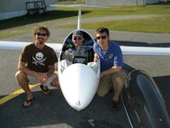 Aerospace Testing Alliance (ATA) Contracting Manager John Dotson, right, and his friends Daniel Schur, left, and Leo Benetti-Longhini, center, pose after a successful 500 kilometer record attempt beginning at Wallaby Ranch near Tampa, Fla., ending at Montezuma, Ga., in April 2007. Schur and Dotson followed Benetti-Longhini the entire way and arrived within minutes after he finished the more than six-hour flight. ATA is the support contractor for AEDC. (Photo provided).