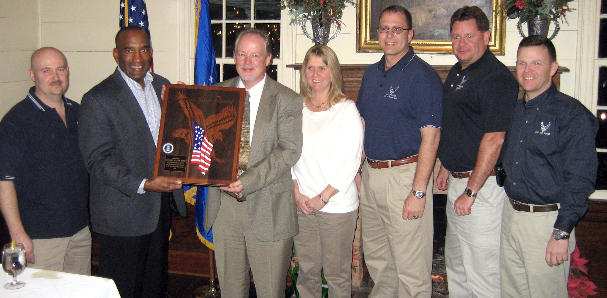 Brig. Gen. A.J. Stewart presents Dennis and Angela Lewis the American Spirit Award during a ceremony Jan. 21 in Perry Ga. Air Force Recruiting Service presented the service's top civic award to program hosts and Southern Woods-N-Water TV for their continued support of Air Force recruiting. Representing the 336th Recruiting Squadron at the presentation were, from left, Master Sgt. Billy Farmer, Tech. Sgt. Thad Smith, Master Sgt. Robert Dixon and Lt. Col. Richard Van Hook. General Stewart is the commander for AFRS. (Courtesy photo)