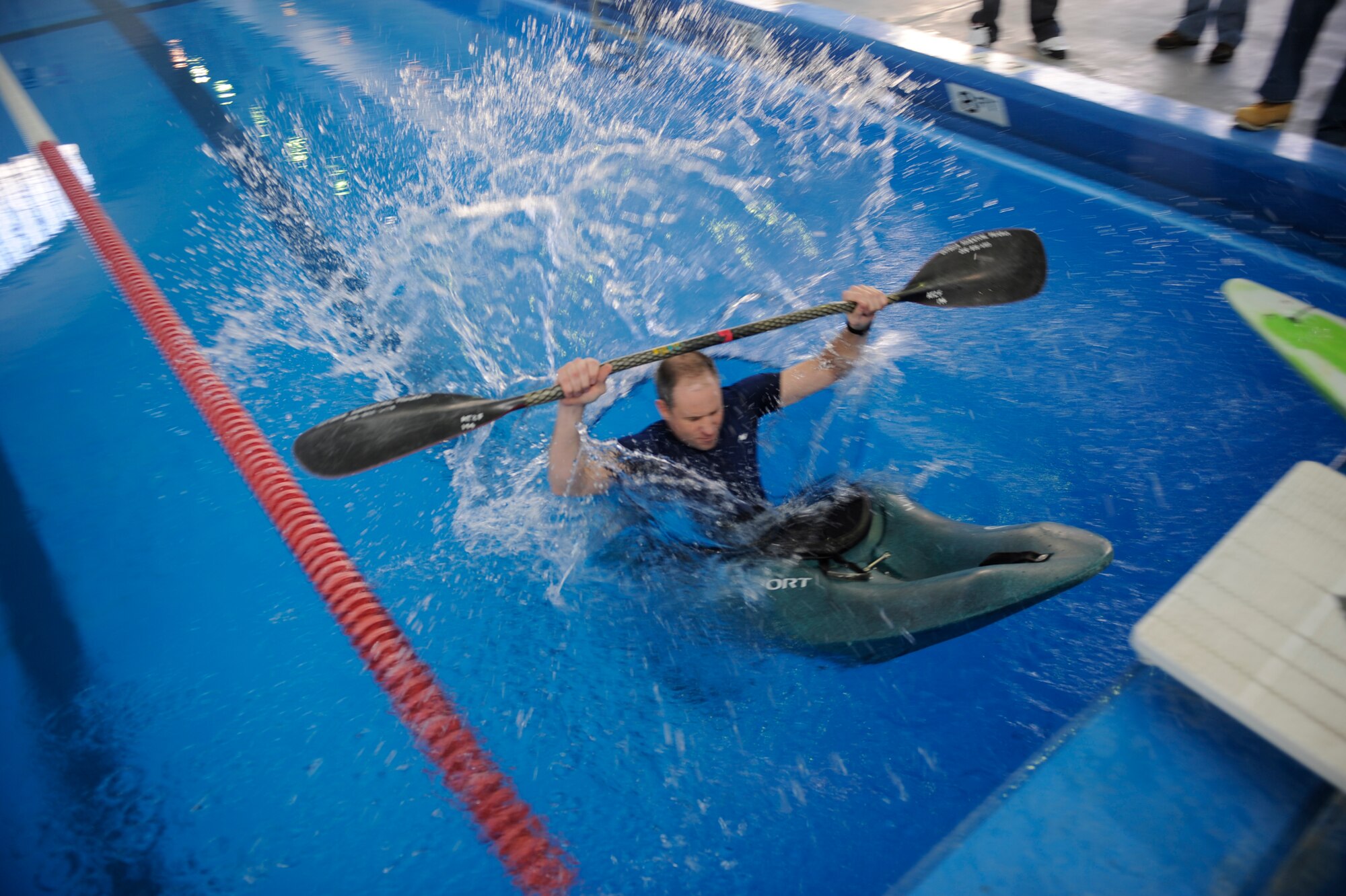 MOUNTAIN HOME AIR FORCE BASE, Idaho - Mike Hurt, 366th Services Squadron Outdoor Adventure Program coordinator, plunges into the pool at the fitness center Jan. 13 to demonstrate a few of the things people learn when they participate in the kayaking class OAP offers to military members and their families. Mr. Hurt spoke to the Airmen as they traveled around base learning about the various activities the 366th Services Squadron offers. (U.S. Air Force photo/ Senior Airman Ryan Crane)