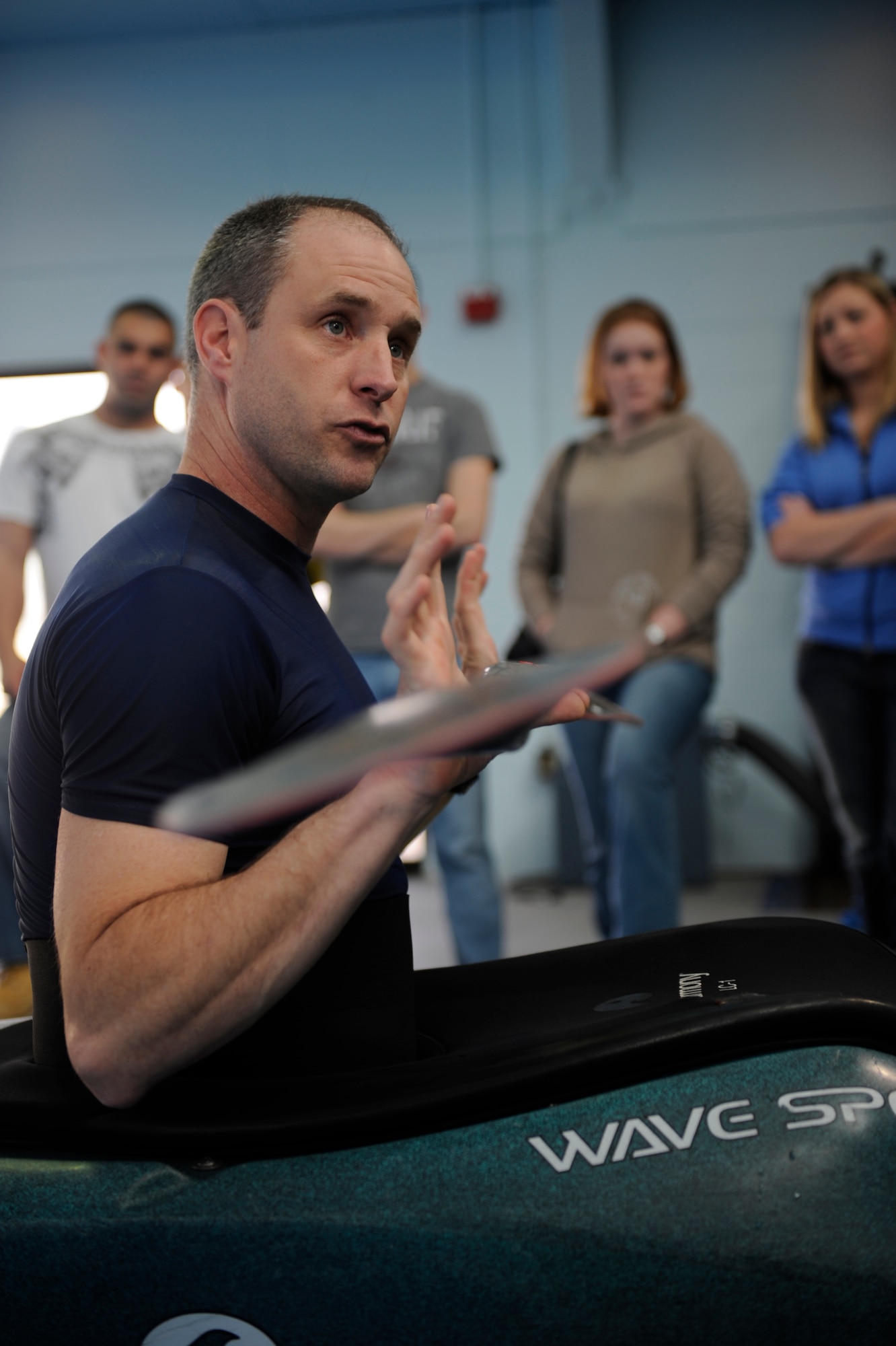 MOUNTAIN HOME AIR FORCE BASE, Idaho - Mike Hurt, 366th Services Squadron Outdoor Adventure Program coordinator, demonstrates to new Airmen from the First-Term Airmen Center how to correctly hold a kayaking paddle Jan. 13. Mr. Hurt spoke to the Airmen as they traveled around base learning about the various activities the 366th Services Squadron offers. (U.S. Air Force photo/ Senior Airman Ryan Crane)