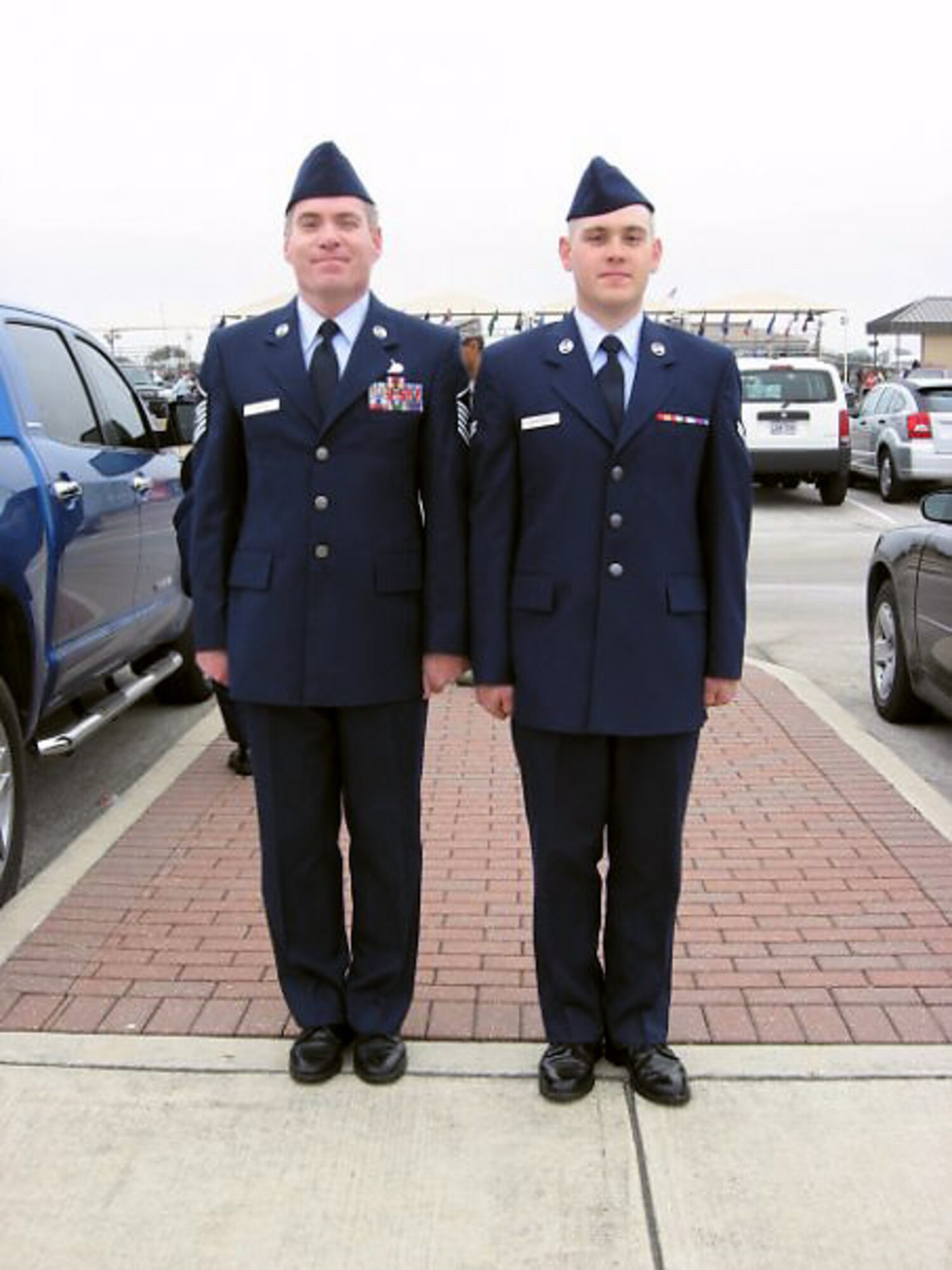 Retired Master Sgt. Tim Childers (left) and his son, Airman 1st Class Steven Childers, stand next to each other after Airman Childers graduated from Basic Military Training at Lackland Air Force Base, Texas. Airman Childers shed 70 pounds to enlist in the Air Force in November. Airman Childers is a 338th Training Squadron electronic principles course student at Keesler AFB, Miss. (Courtesy photo)
