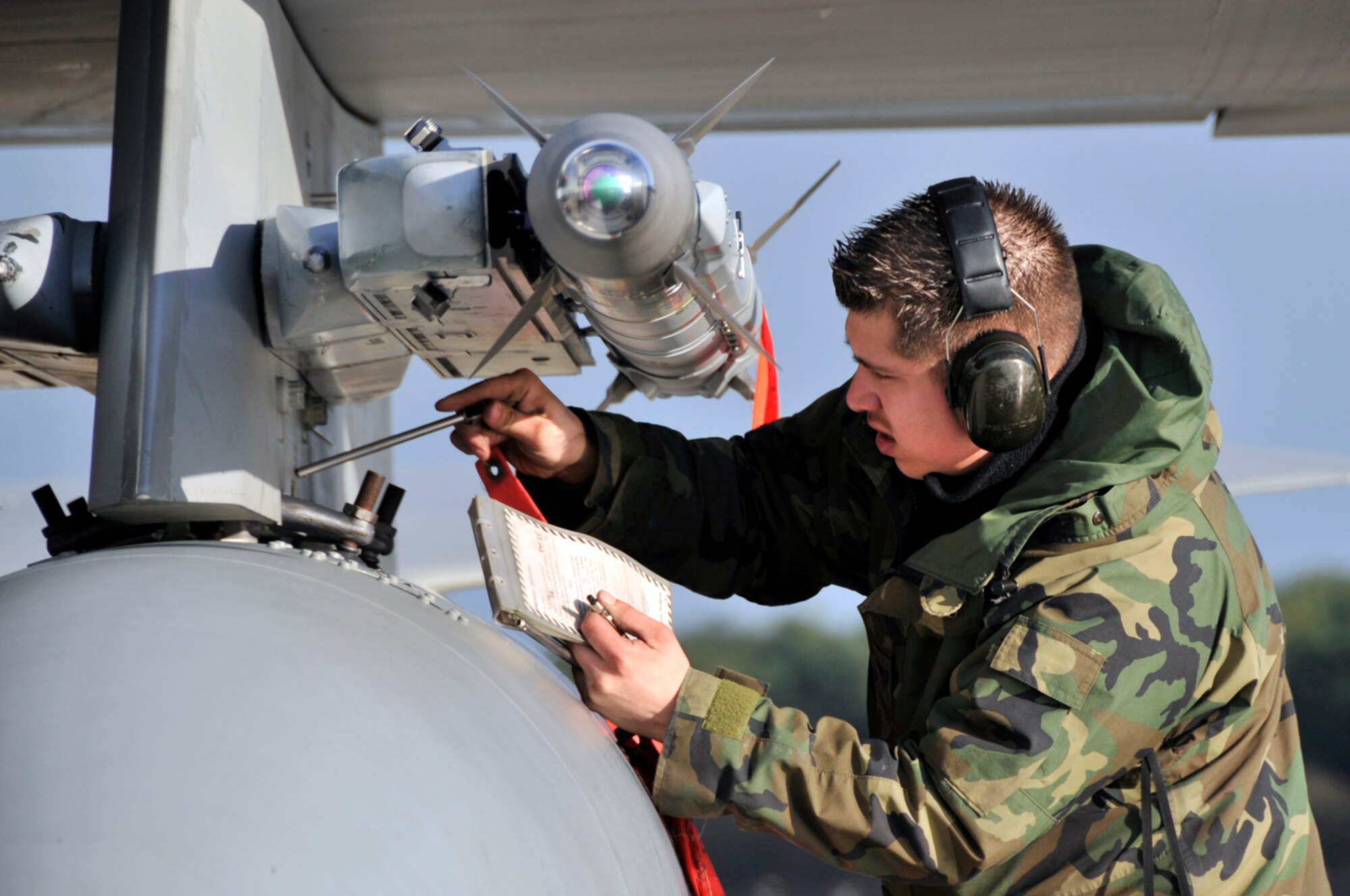 Staff Sgt. Ken Beltran, 48th Munitions Squadron weapons load crew member, disarms an AIM-9 Sidewinder on an F-15 Eagle, Jan. 5 at RAF Lakenheath, England. The 493rd Fighter Squadron had just returned from Lithuania, after being deployed there for three months to participate in the NATO Baltic Air Policing mission. (U.S. Air Force photo by Airman 1st Class Perry Aston)