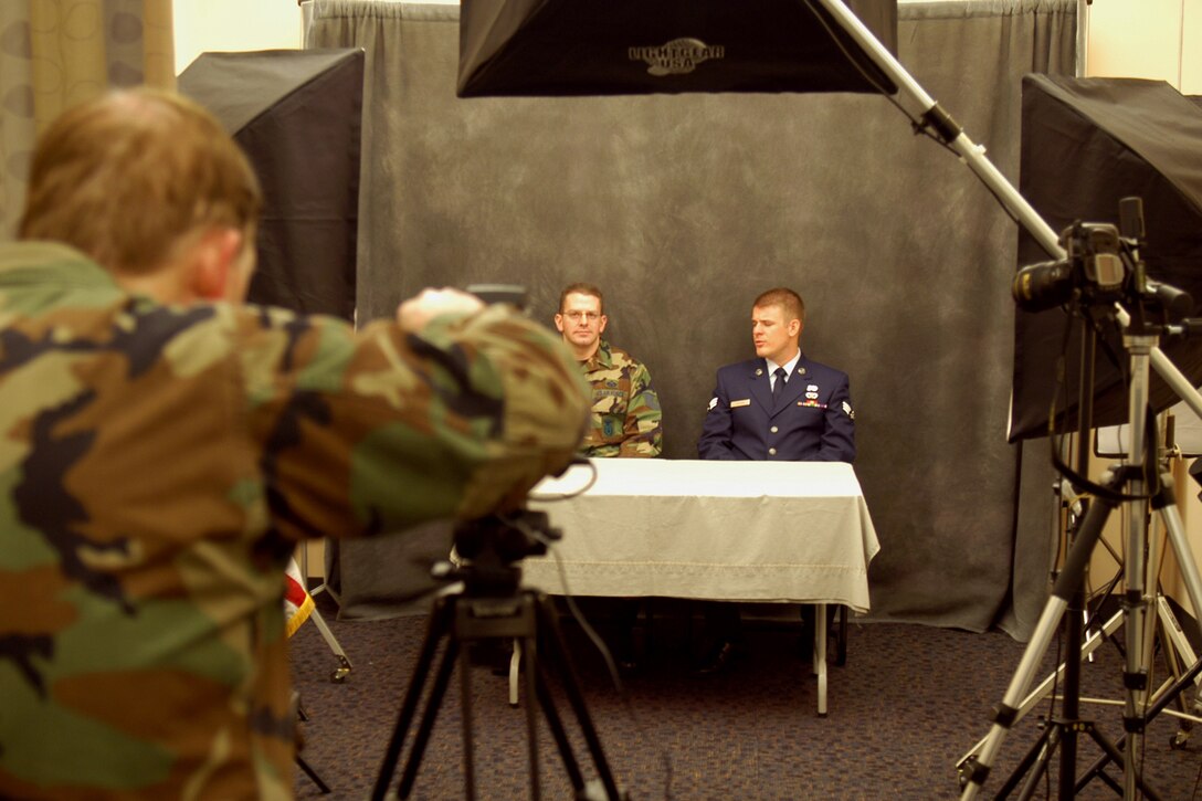 GRISSOM AIR RESERVE BASE, Ind., - Grissom television is up and running. Grissom members are able to see recording's of interviews, Air Force Now and news briefs. Here yearly award winners Tech. Sgt. Robert DeLee, 434th Security Forces Squadron fire team leader, and Senior Airman Joseph Ahlers, 434th Civil Engineer Squadron, prepare for an interview with Lt. Col. Gary Lockard, chief of public affairs, for an episode of 'The Beat.' (U.S. Air Force photo/Senior Airman Carl Berry)